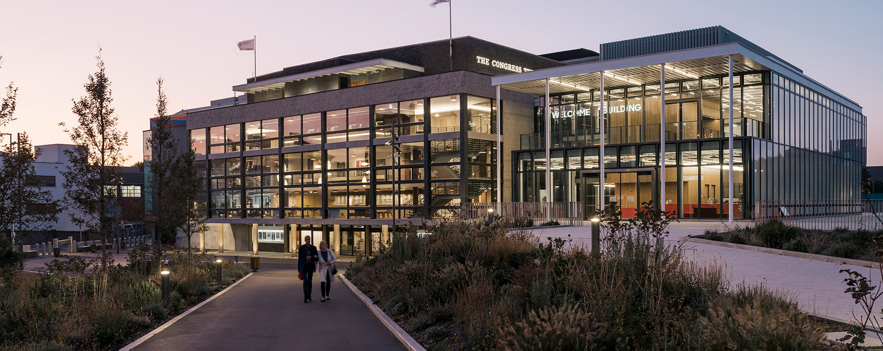 Modern Welcome Building venue with glass facades, perfect for events and meetings.