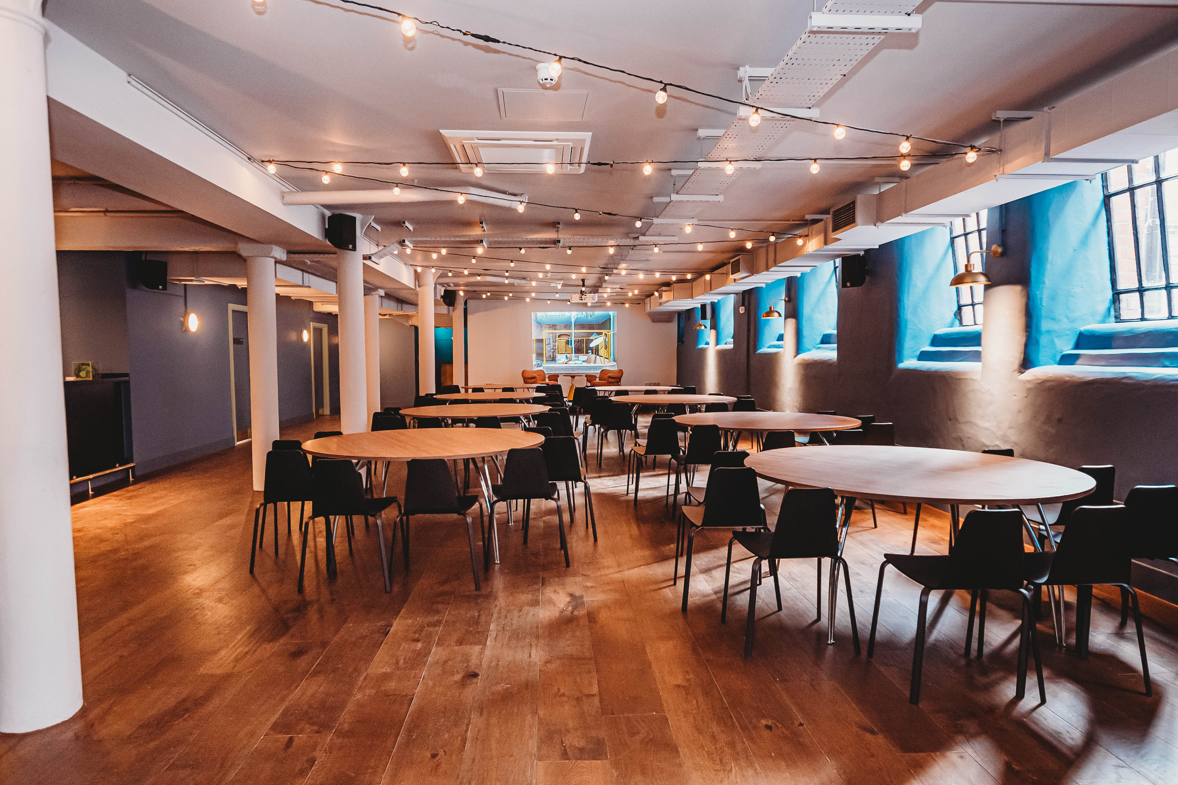 Modern event space at The Storehouse, featuring natural light and flexible seating arrangements.