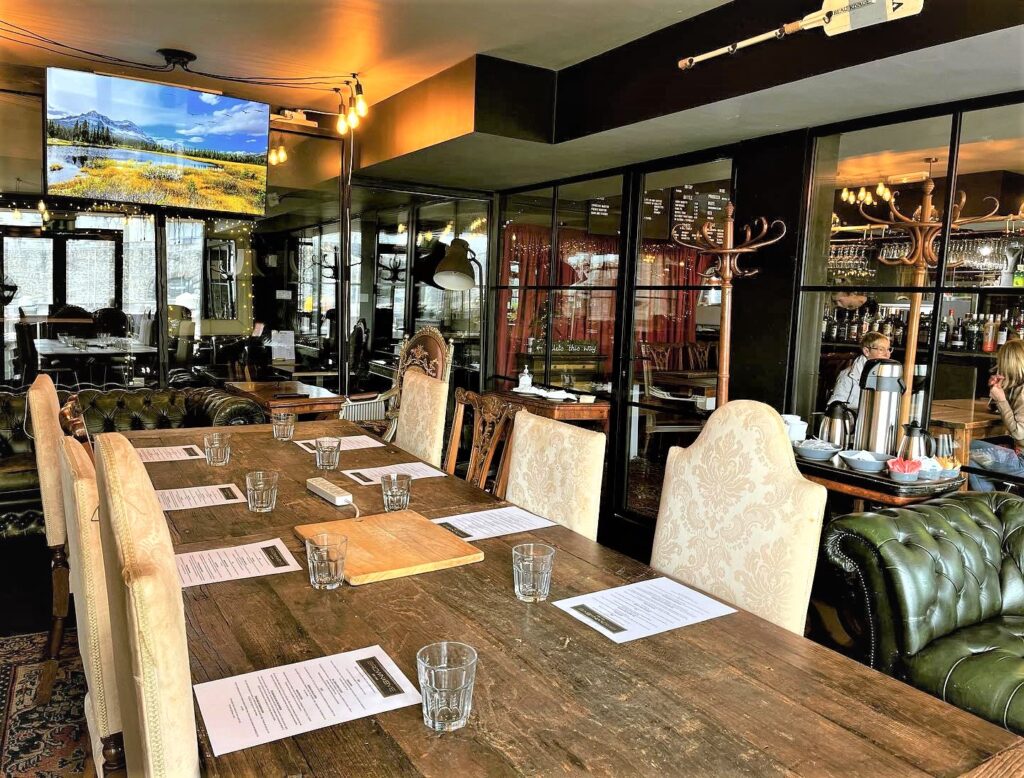 Private dining room at BROWN & BYE with elegant table for corporate meetings and events.