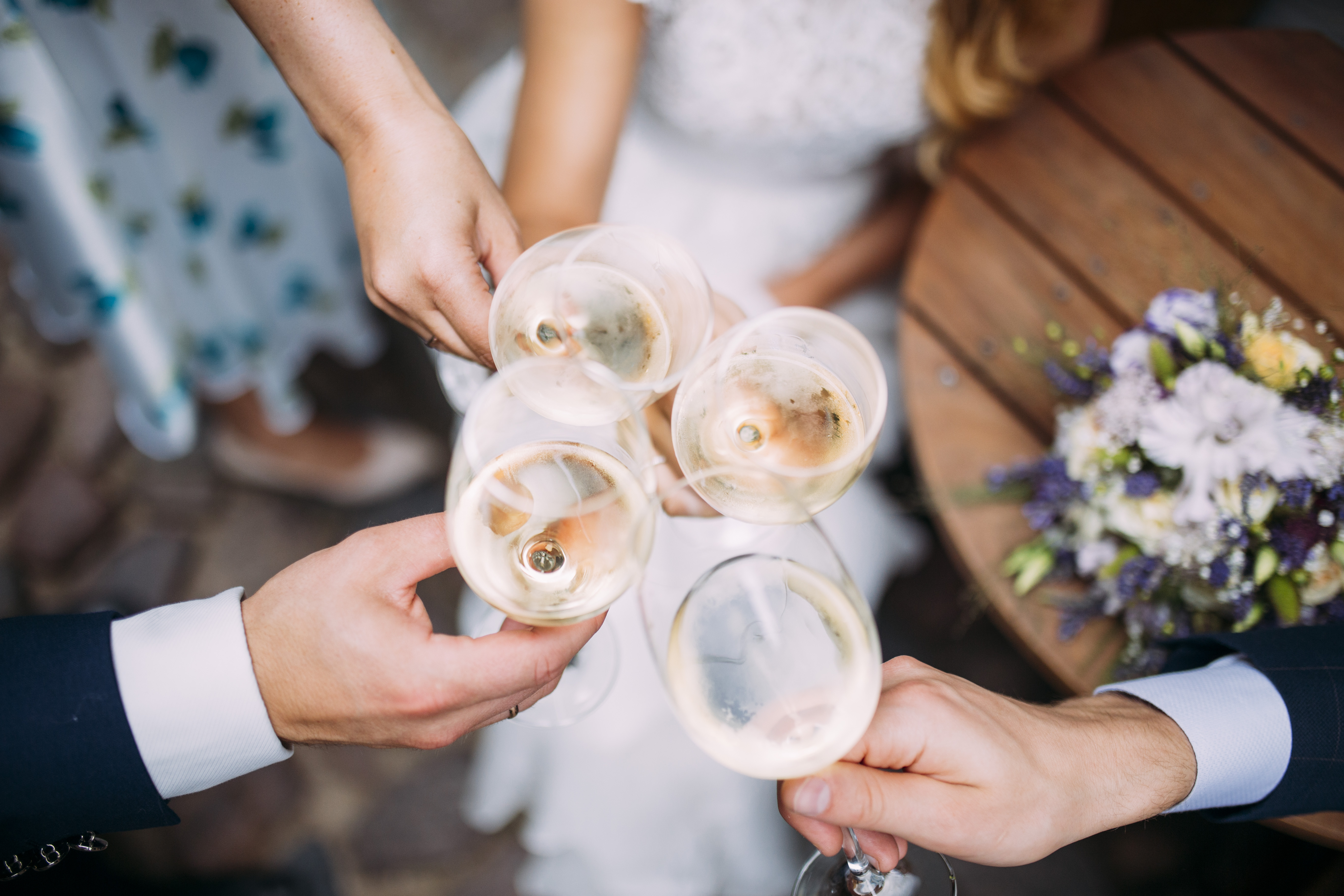 Elegant wedding toast in BROWN & BYE's Private Dining Room with champagne glasses.