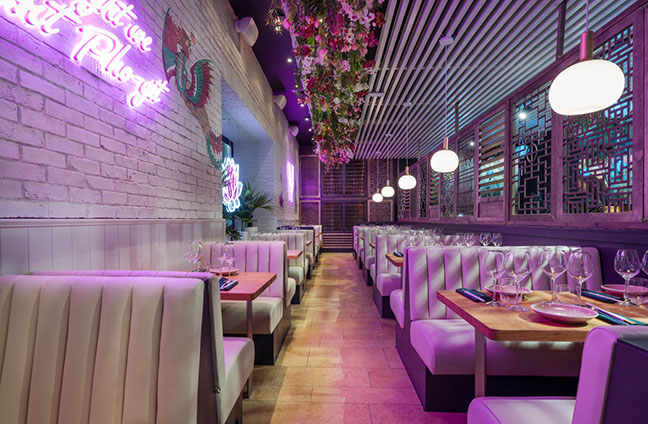 Vibrant Namii Kitchen & Cocktails restaurant with stylish booths for events and gatherings.