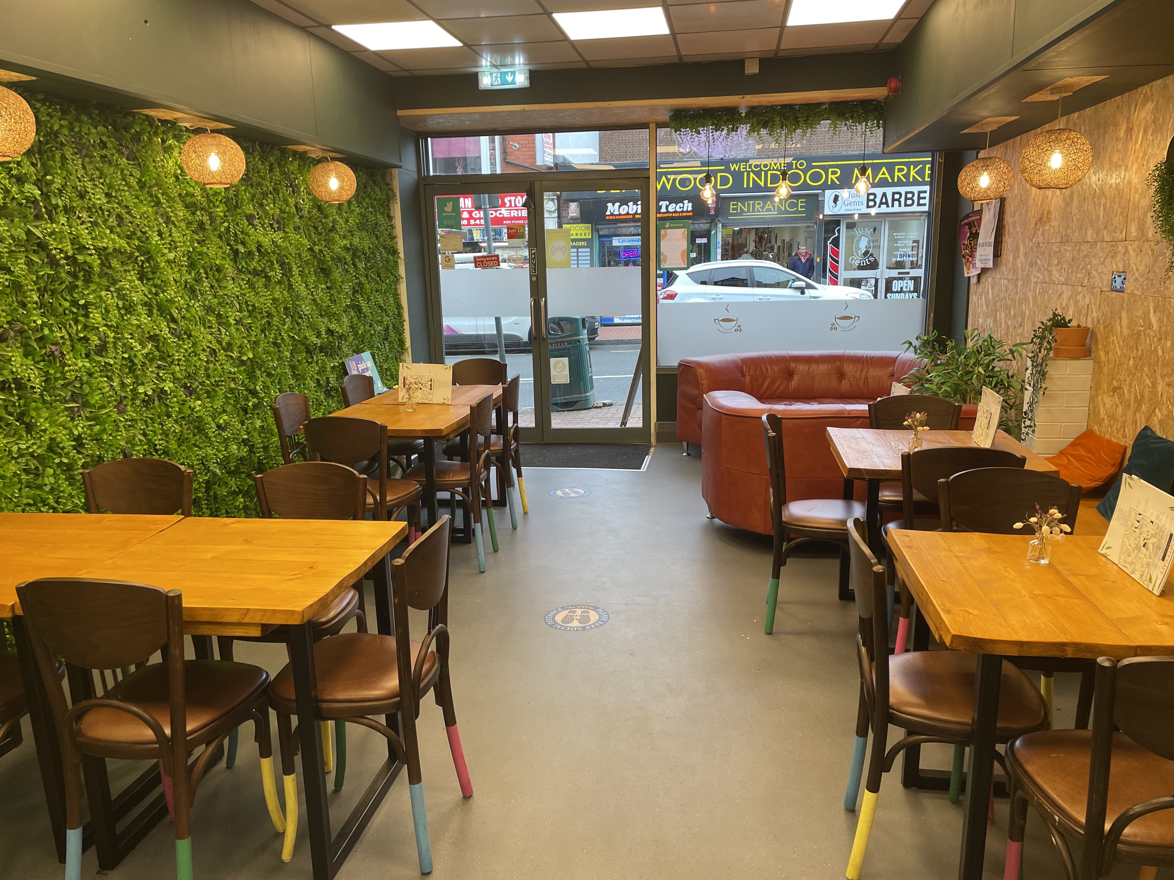 Serenity Cafe cozy venue with wooden tables, perfect for casual networking events.