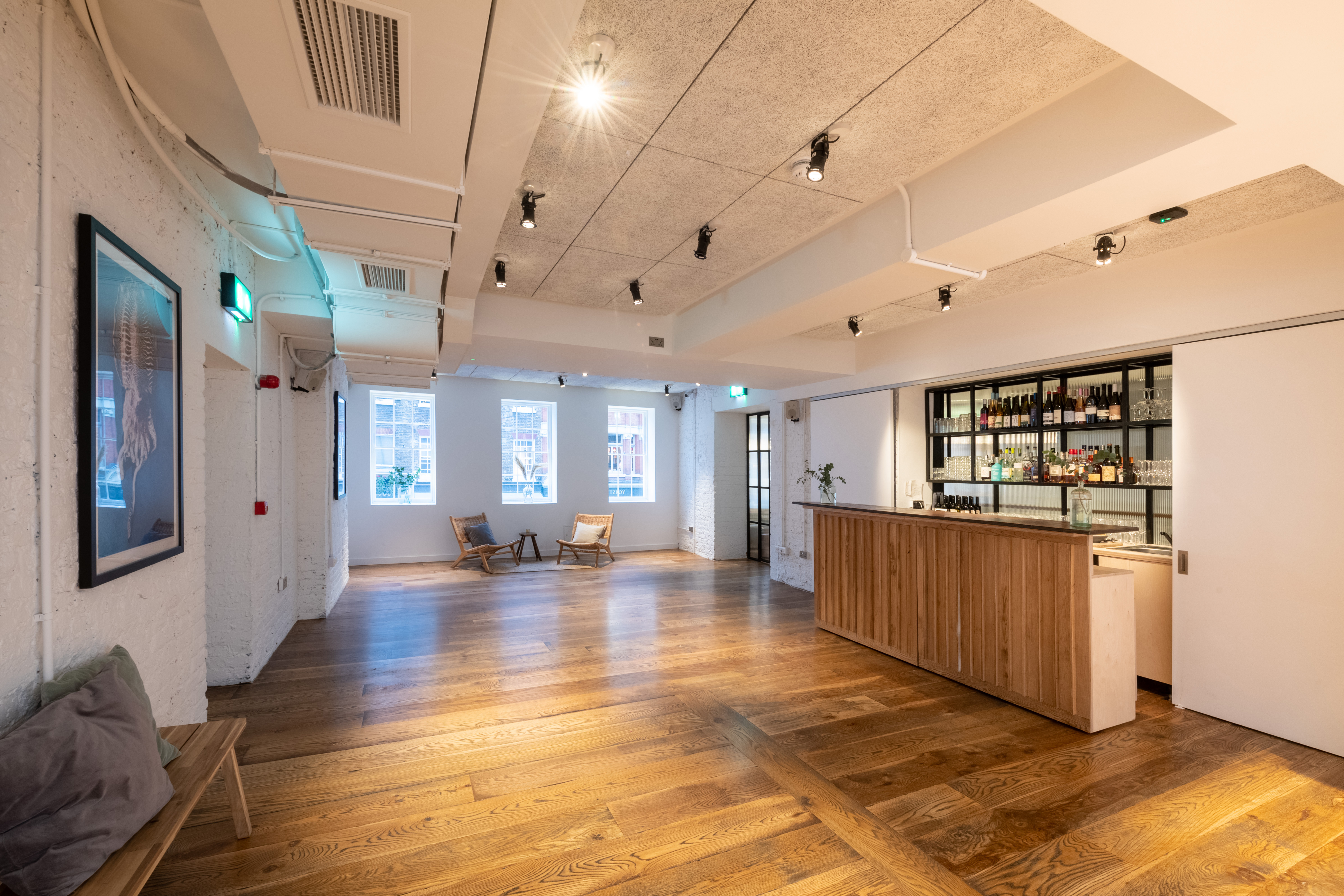 Versatile White Room at Carousel London with wooden flooring, ideal for events and meetings.