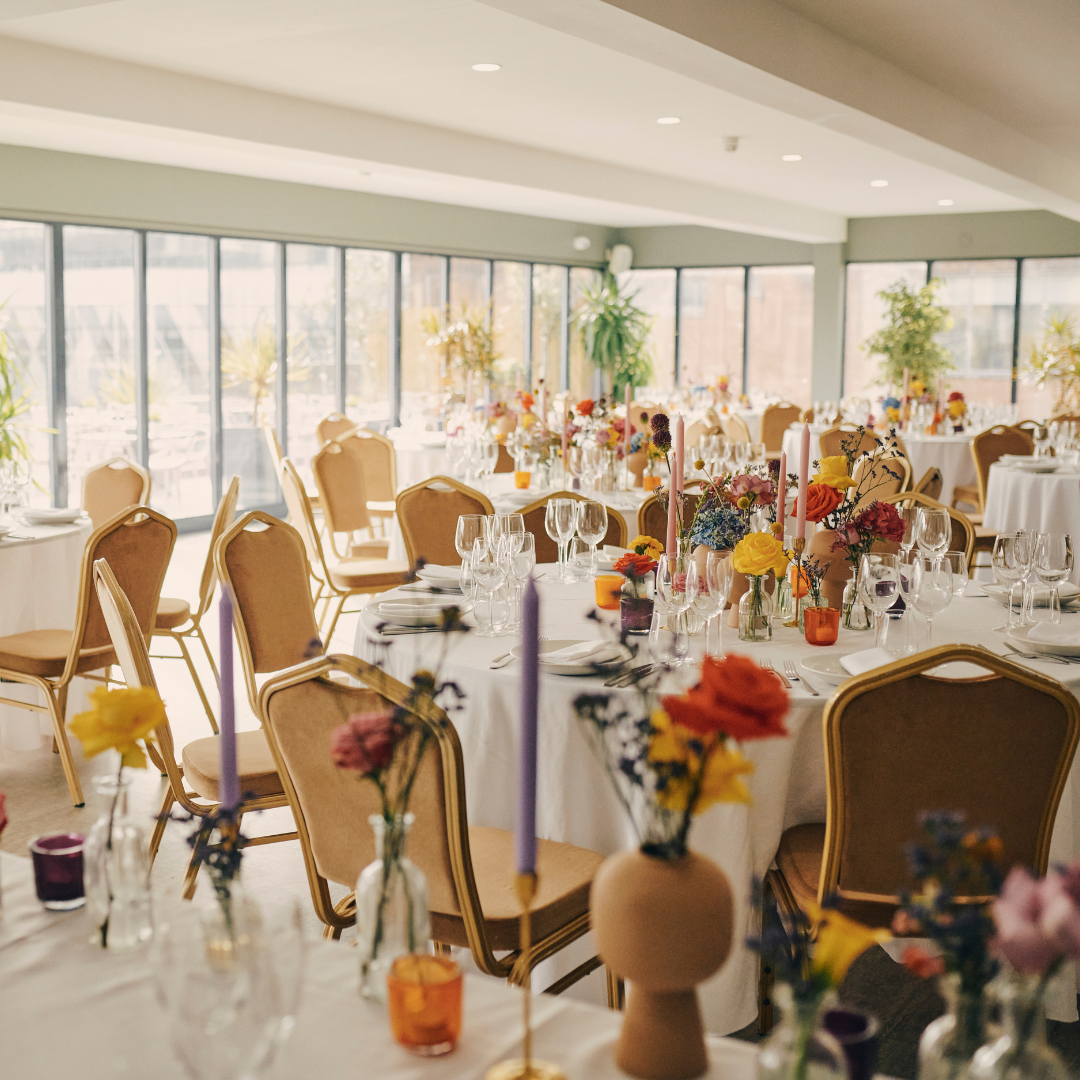 John Rylands Rooftop event space with elegant tables, ideal for weddings and upscale gatherings.