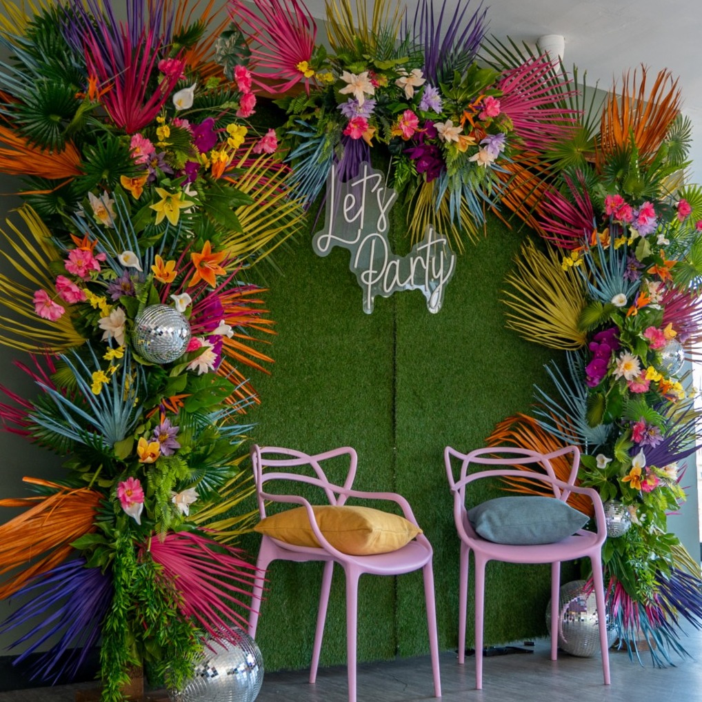 "Vibrant floral backdrop at John Rylands Rooftop for festive gatherings and celebrations."