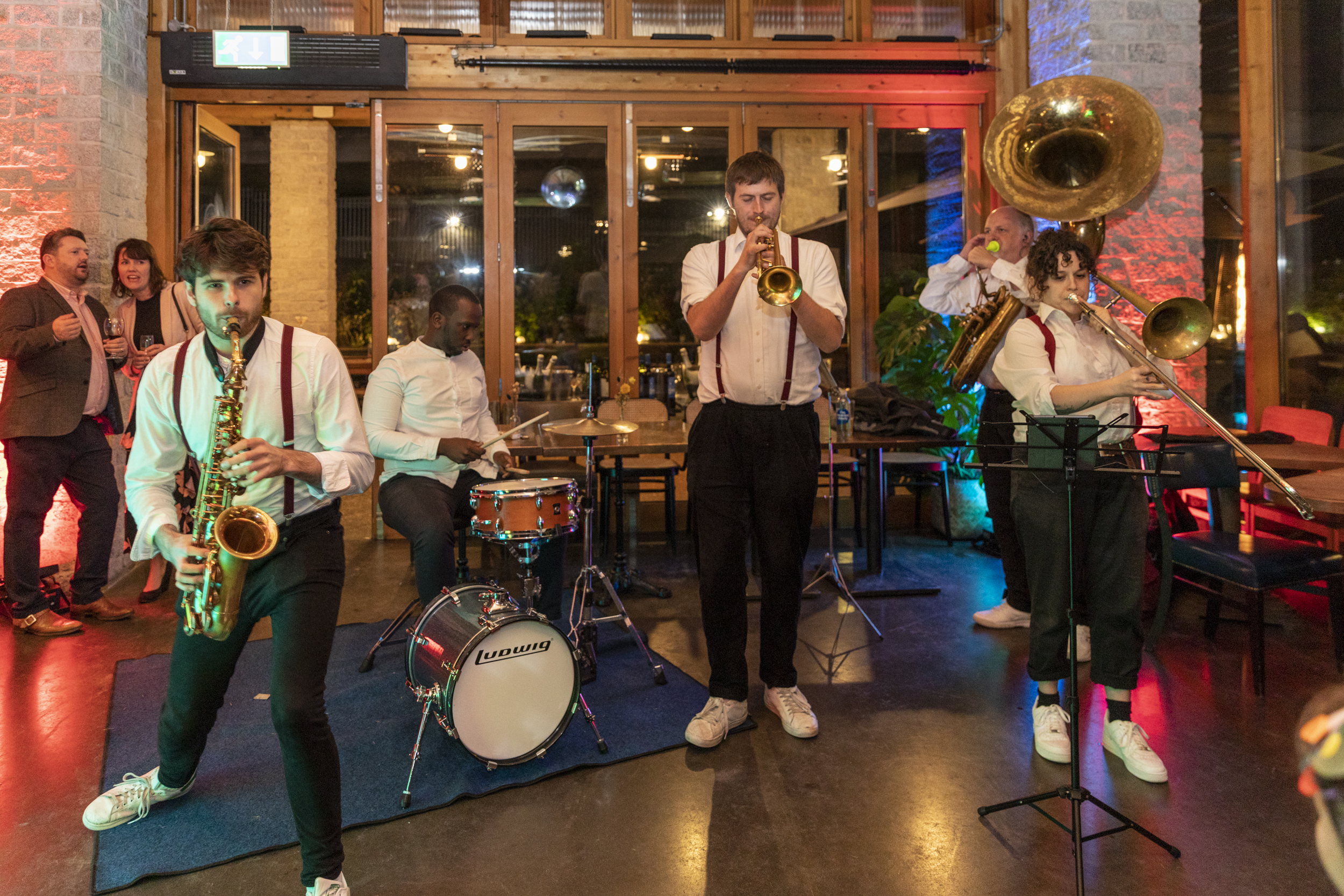 Lively band performing in stylish venue, perfect for networking and entertainment events.