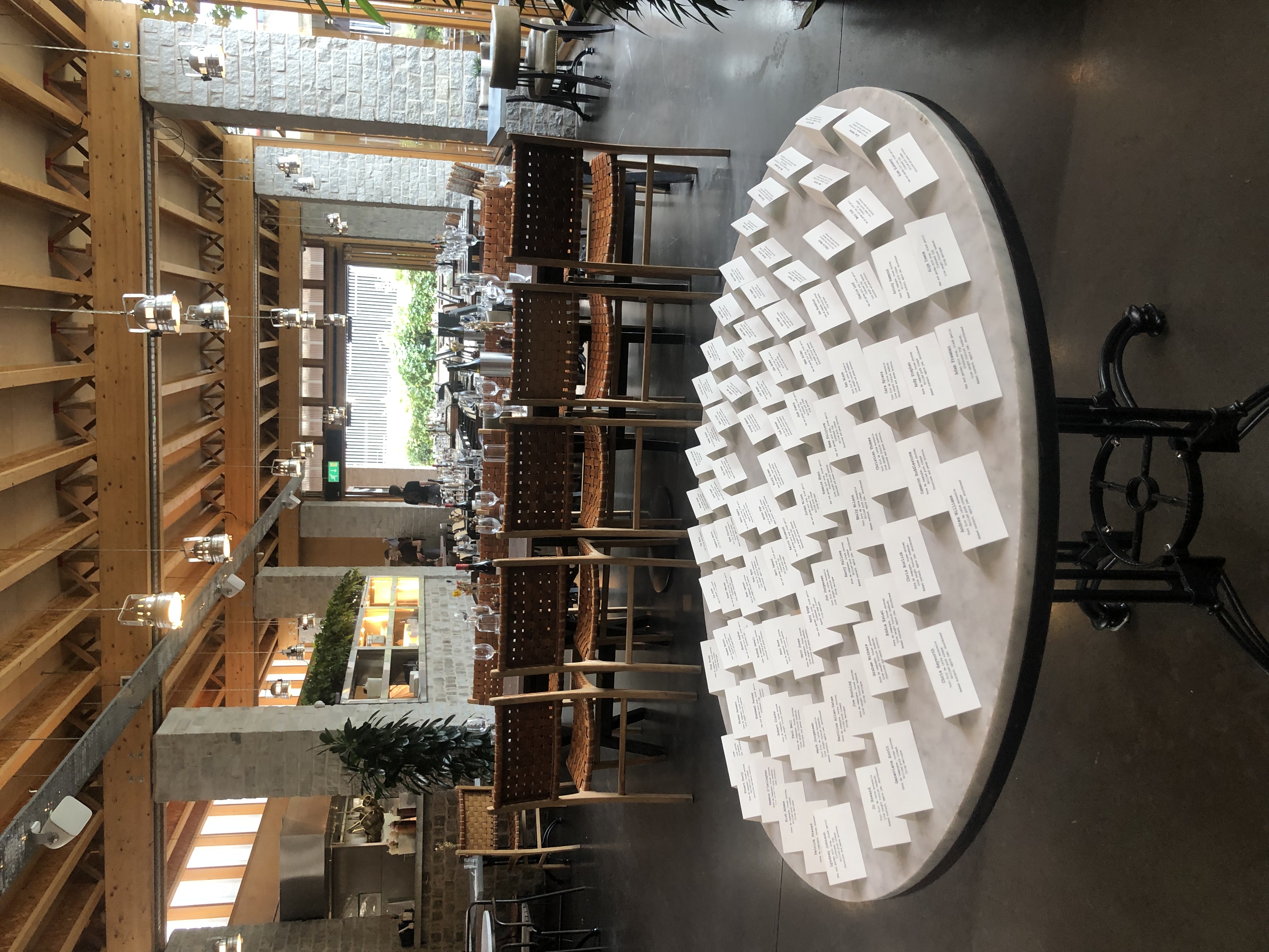 Upscale event seating with round table and place cards in The Greenroom.