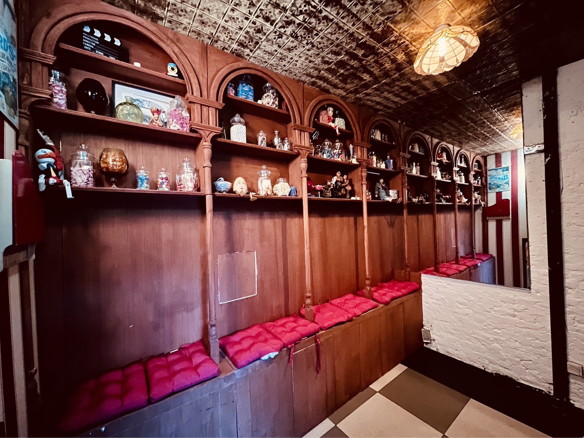 Cozy alcove at Bonkers Bar with decorative shelves, perfect for creative events.