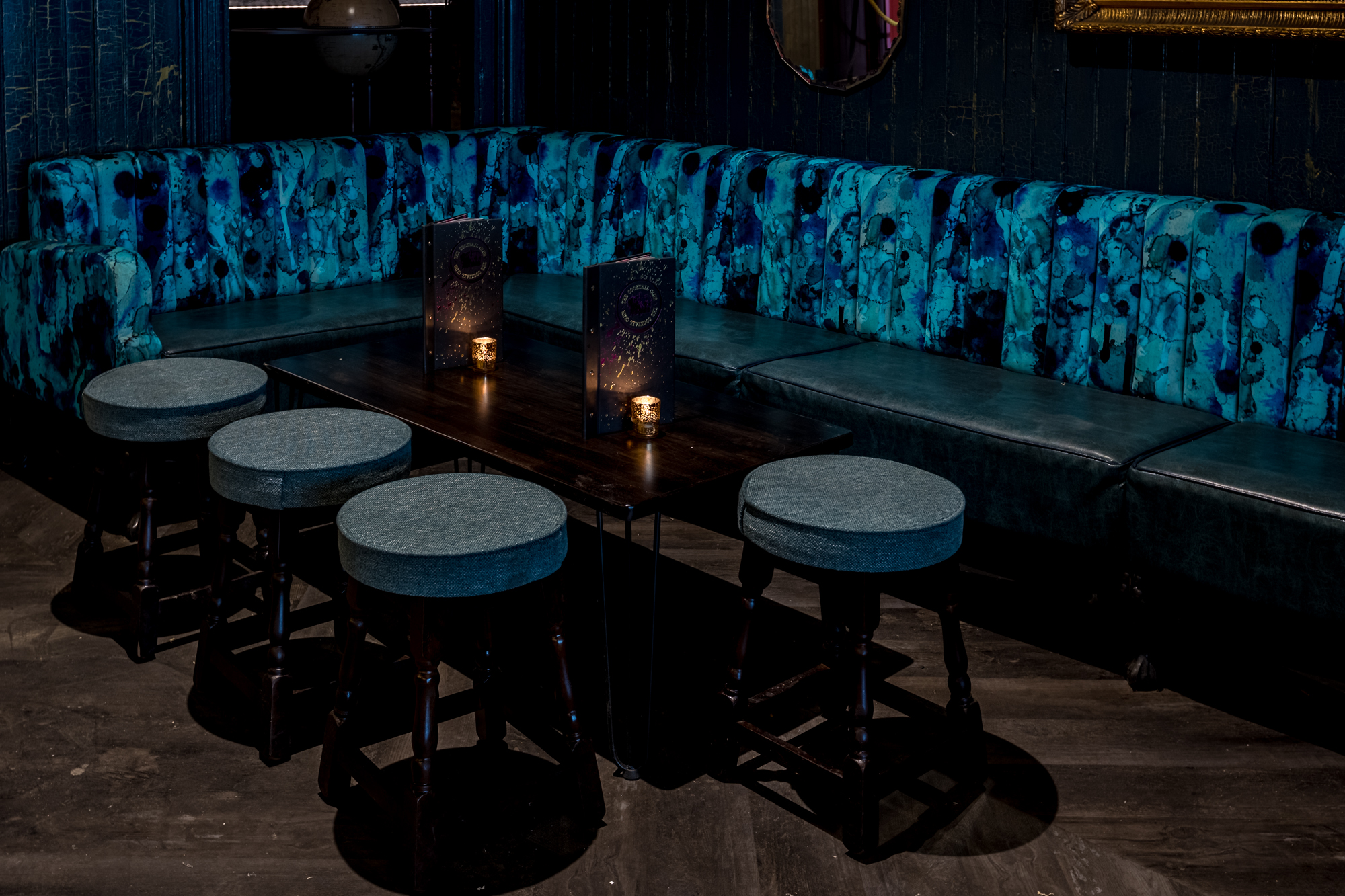 Stylish lounge with blue velvet couch, ideal for networking events in Exeter.