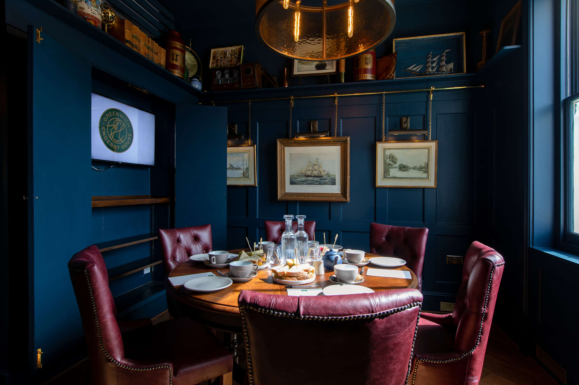 Elegant meeting room in Enderby House with round table, ideal for executive gatherings.