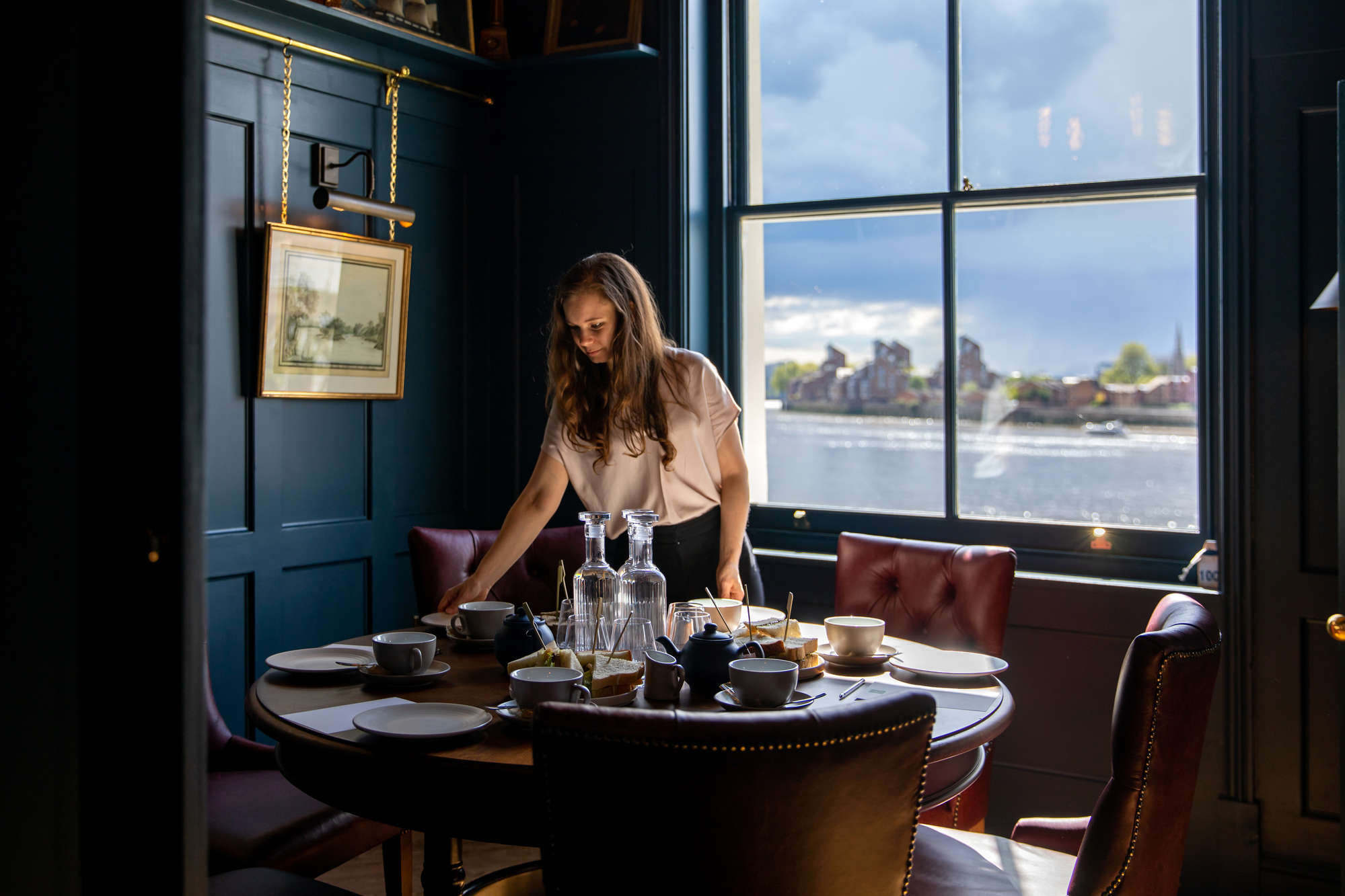 Elegant meeting space in Enderby House with fine china, ideal for executive gatherings.