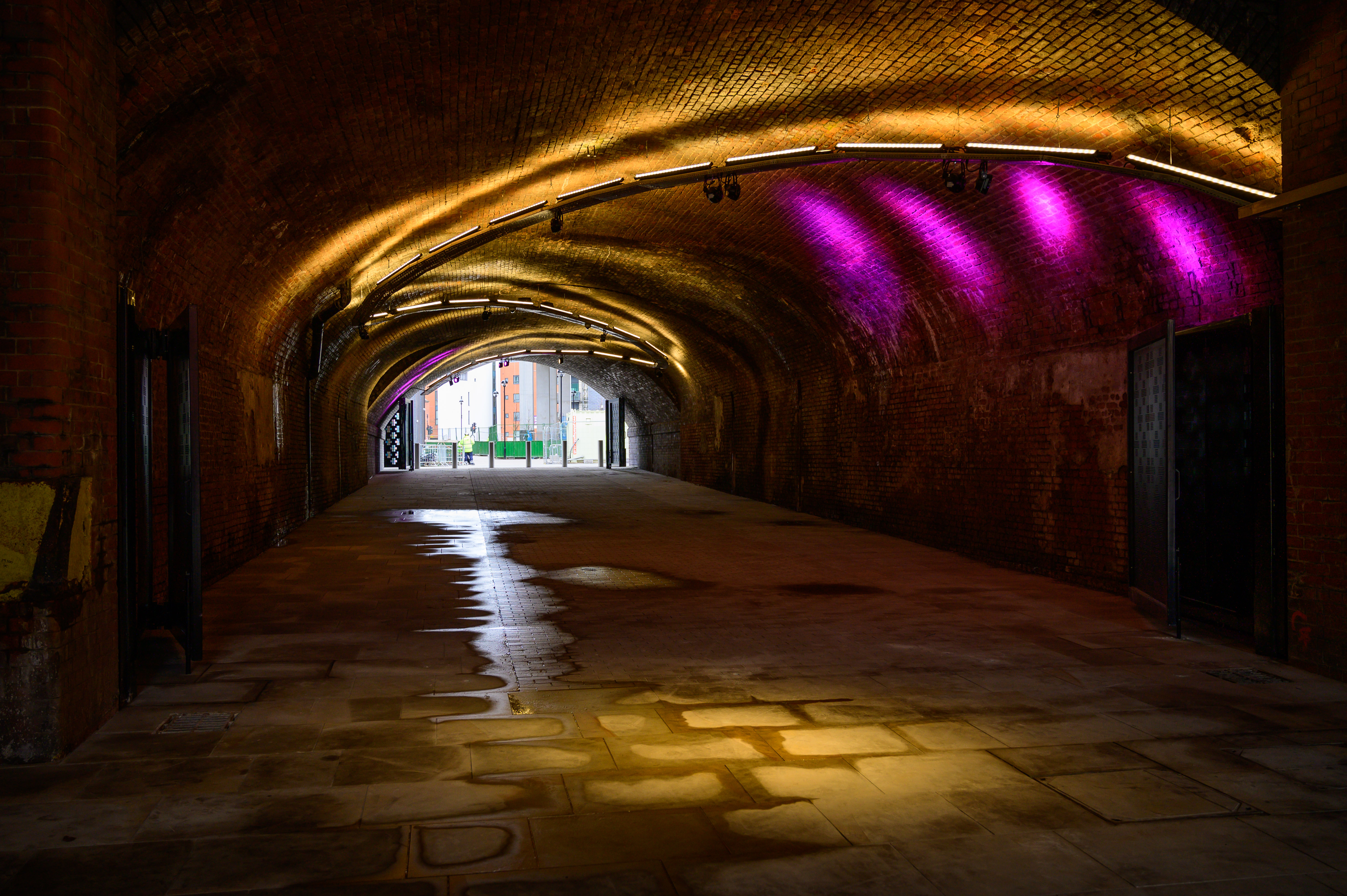 Illuminated arched tunnel at The Arch, New Bailey - perfect for creative events and receptions.