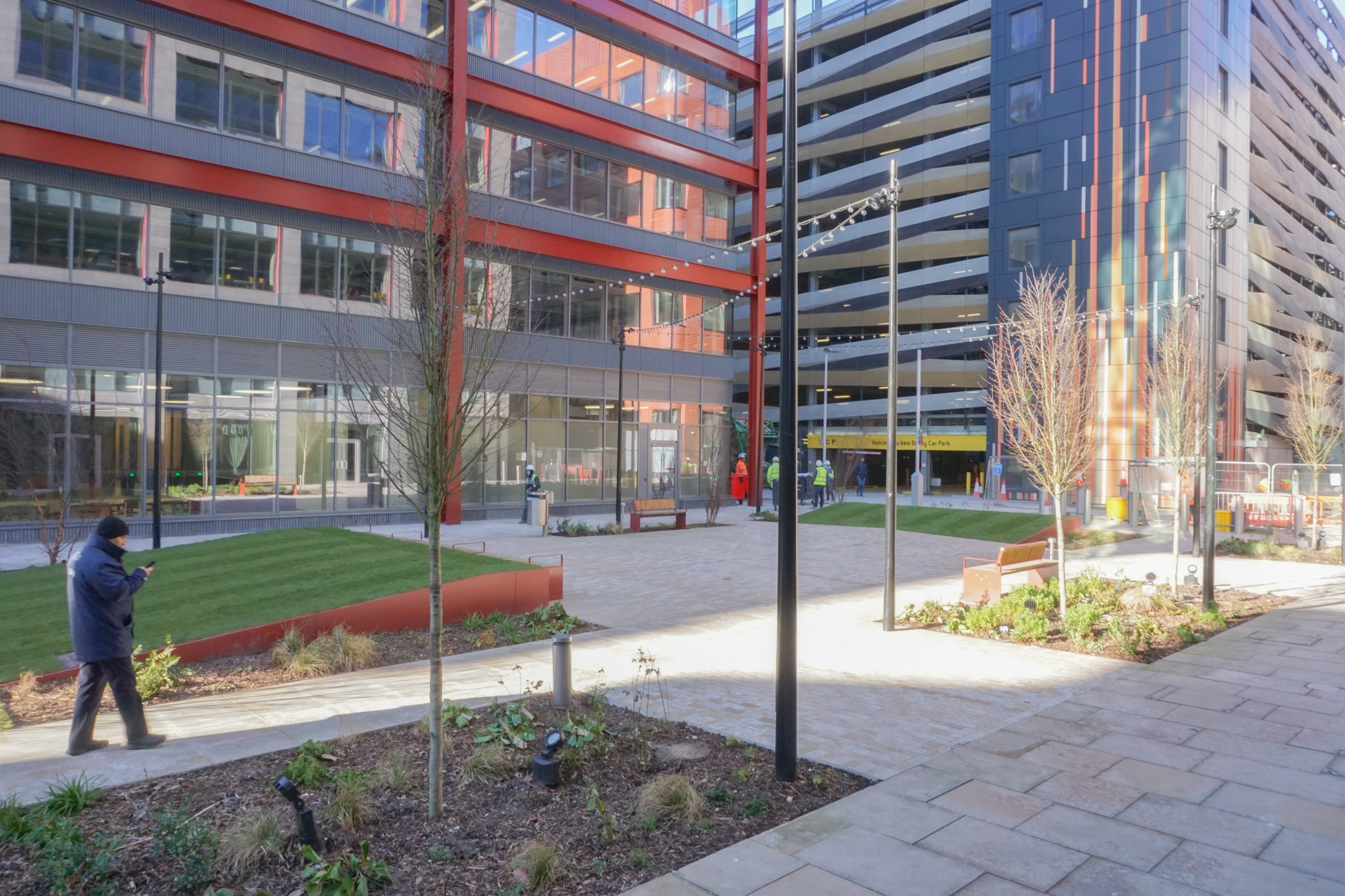 Modern outdoor event venue in New Bailey Square with landscaped seating and natural light.