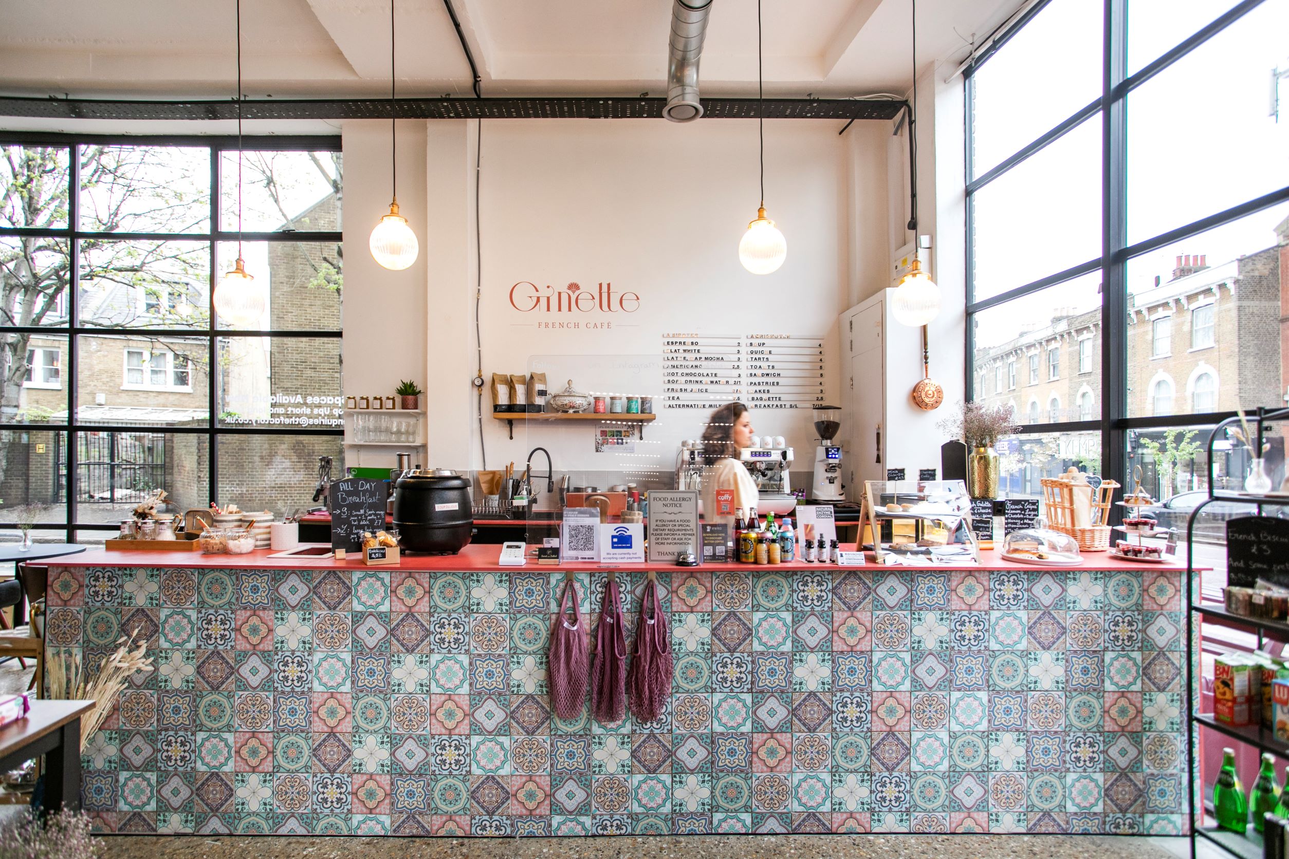Vibrant Ginette French Café with colorful tiles, ideal for networking events and meetings.