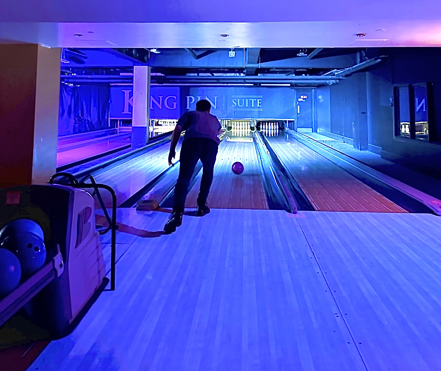 Vibrant bowling alley in The KingPin Suite for team-building and corporate events.