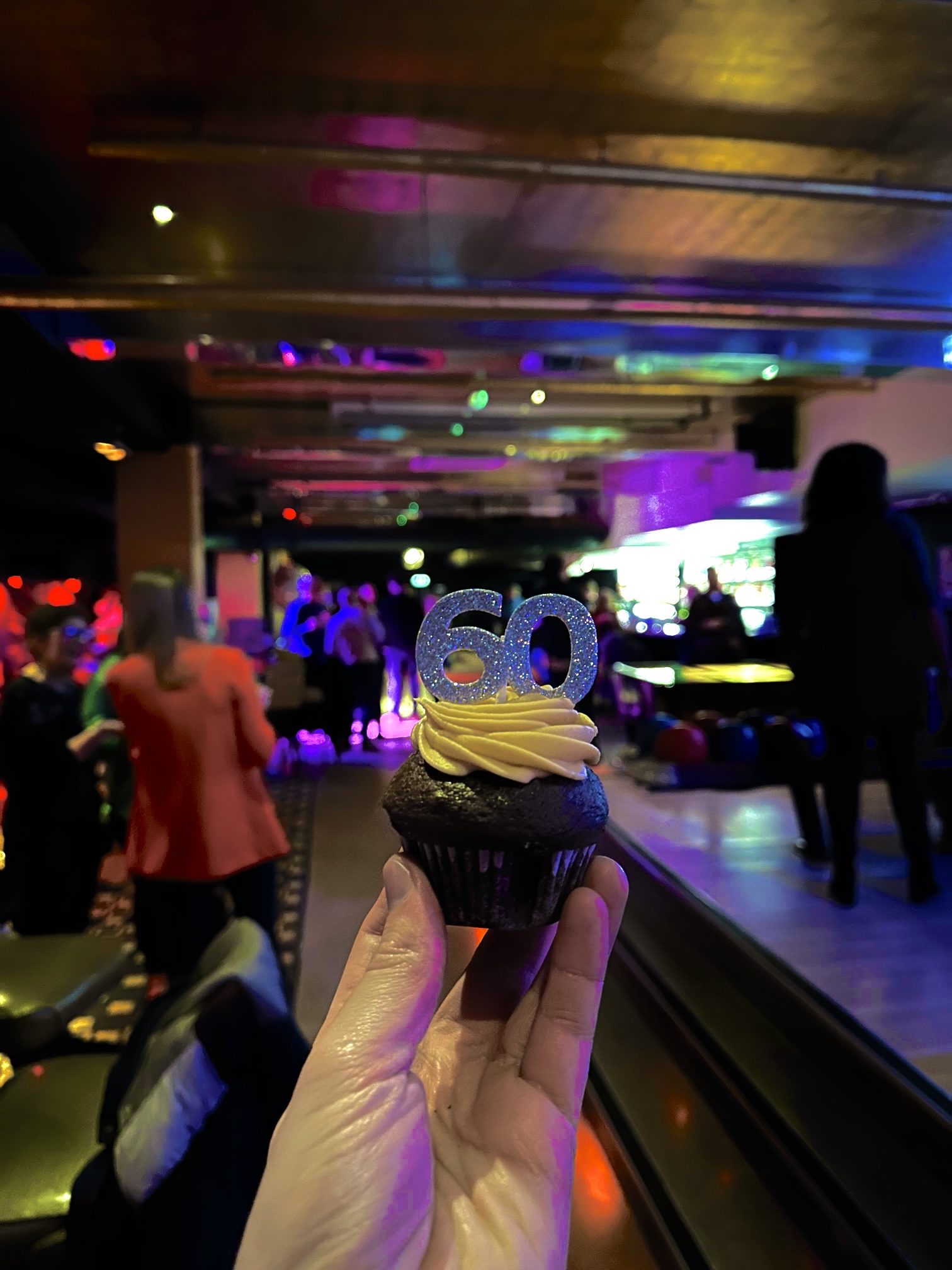 Festive birthday celebration in KingPin Suite with elegant "60" cupcake centerpiece.