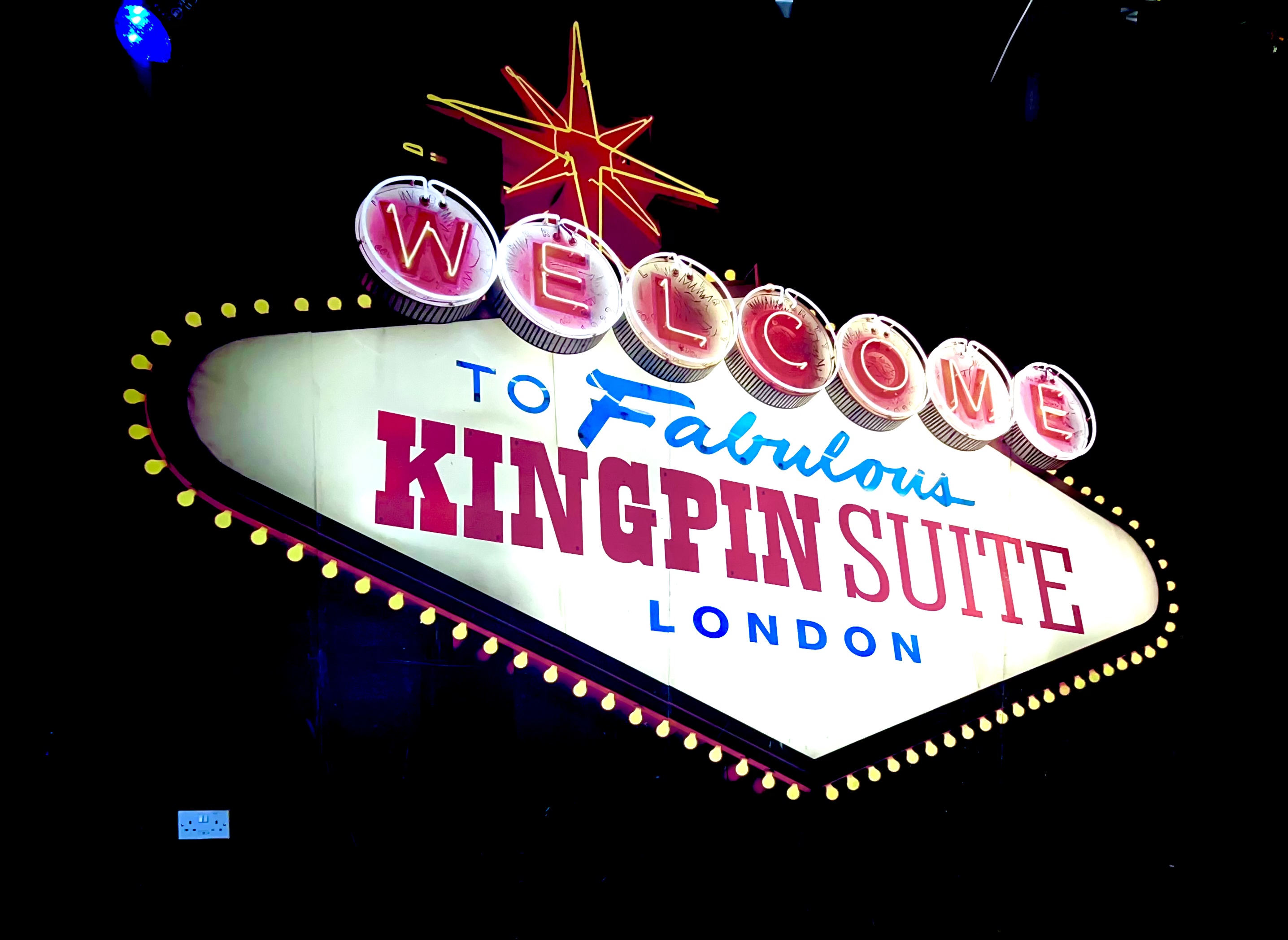 Vibrant marquee sign for KingPin Suite, a unique London event venue.