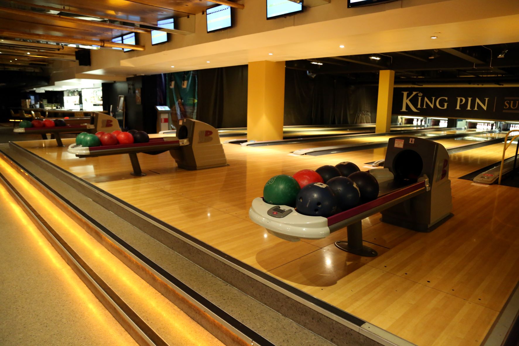 Vibrant bowling alley in KingPin Suite, perfect for corporate events and team-building.