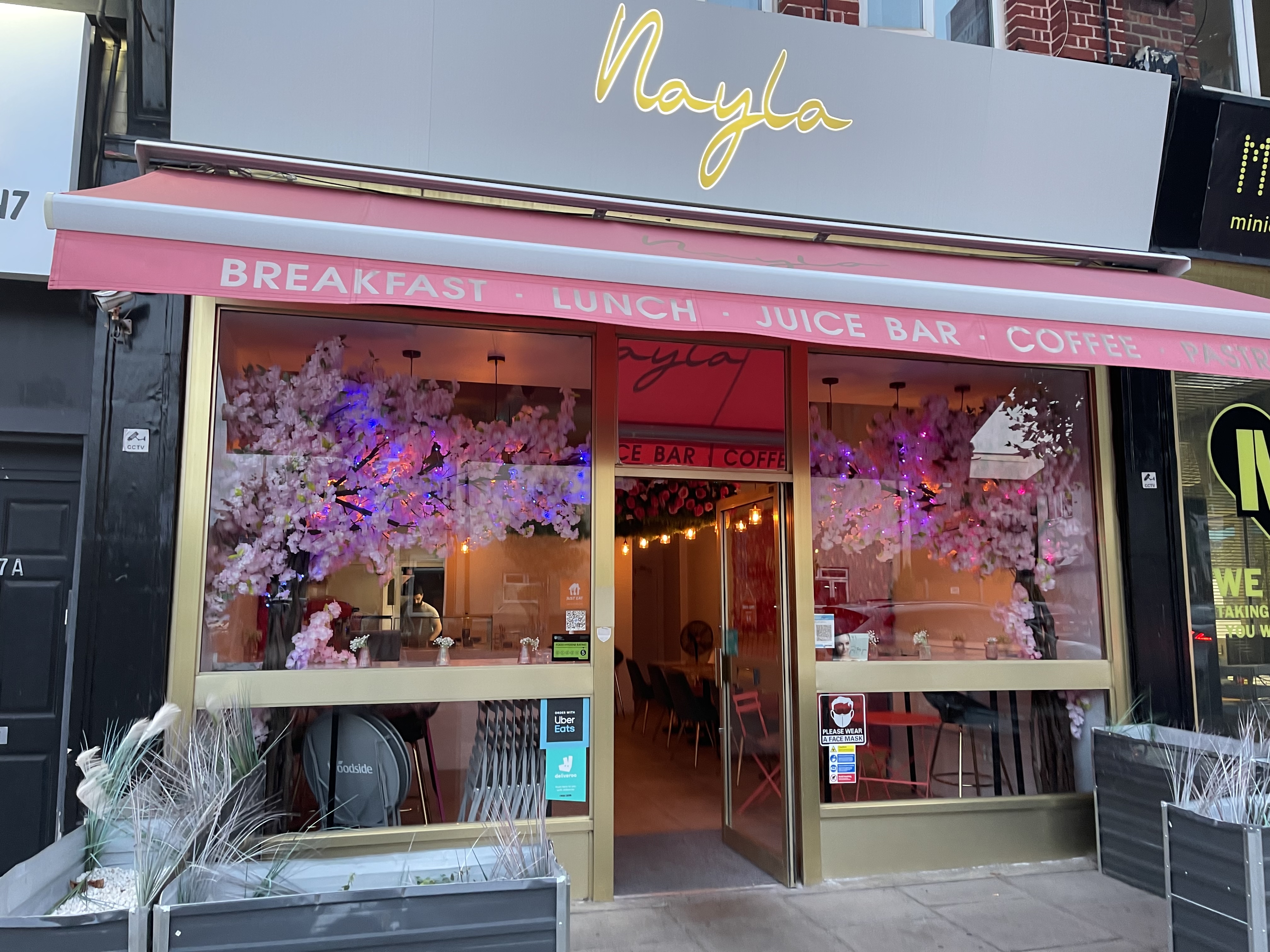 Charming Nayla cafe with vibrant decor, perfect for casual meetings and events.