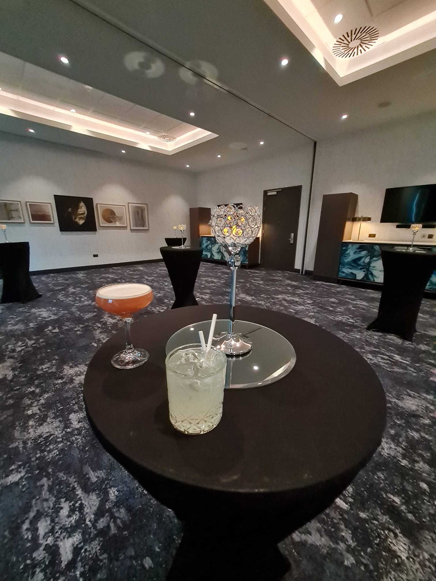 Bucksburn Suite at Hilton Aberdeen TECA, elegant cocktail reception setup with ambient lighting.