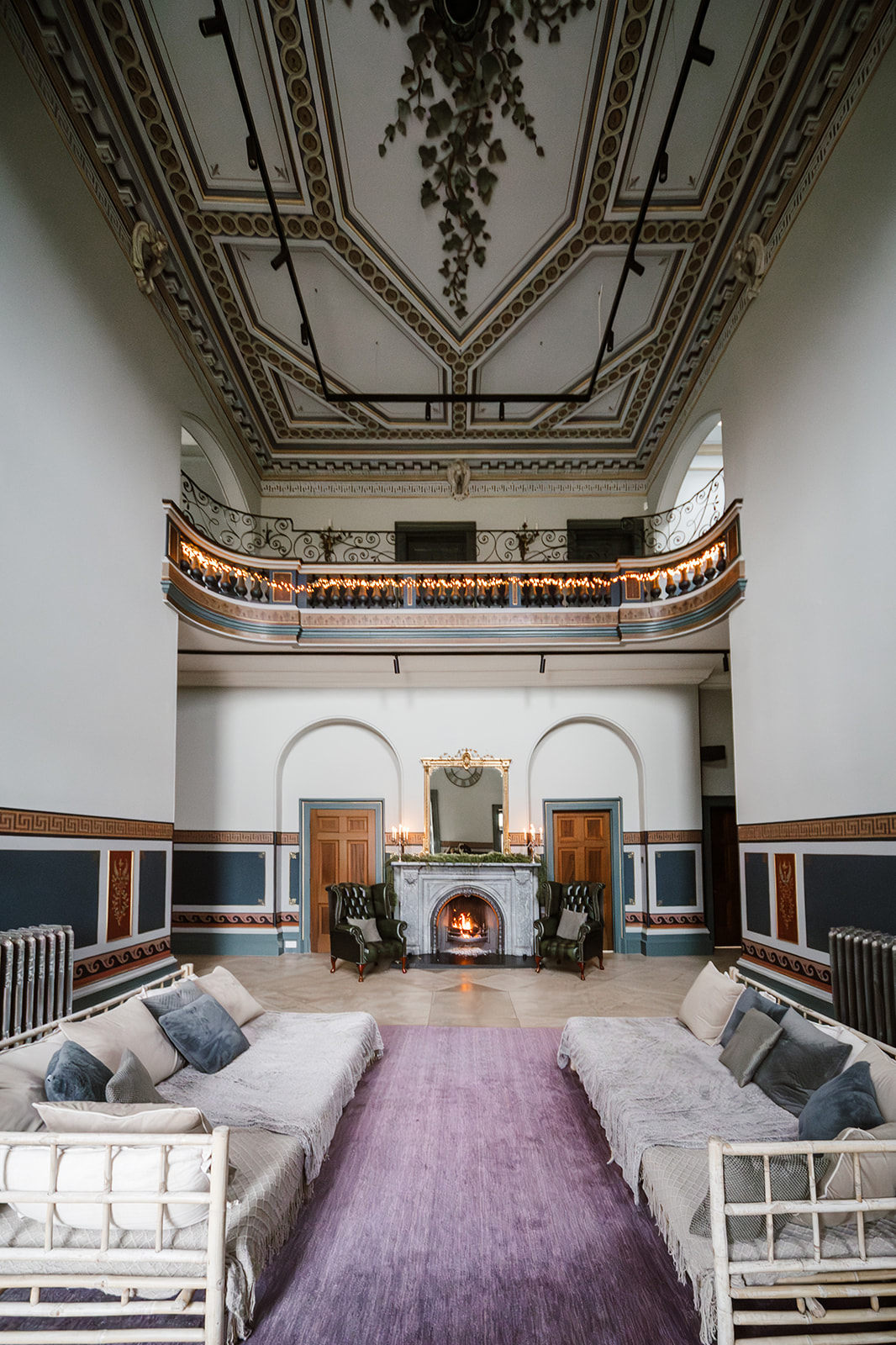 Historic venue with mezzanine and fireplace for luxury event or corporate production space.