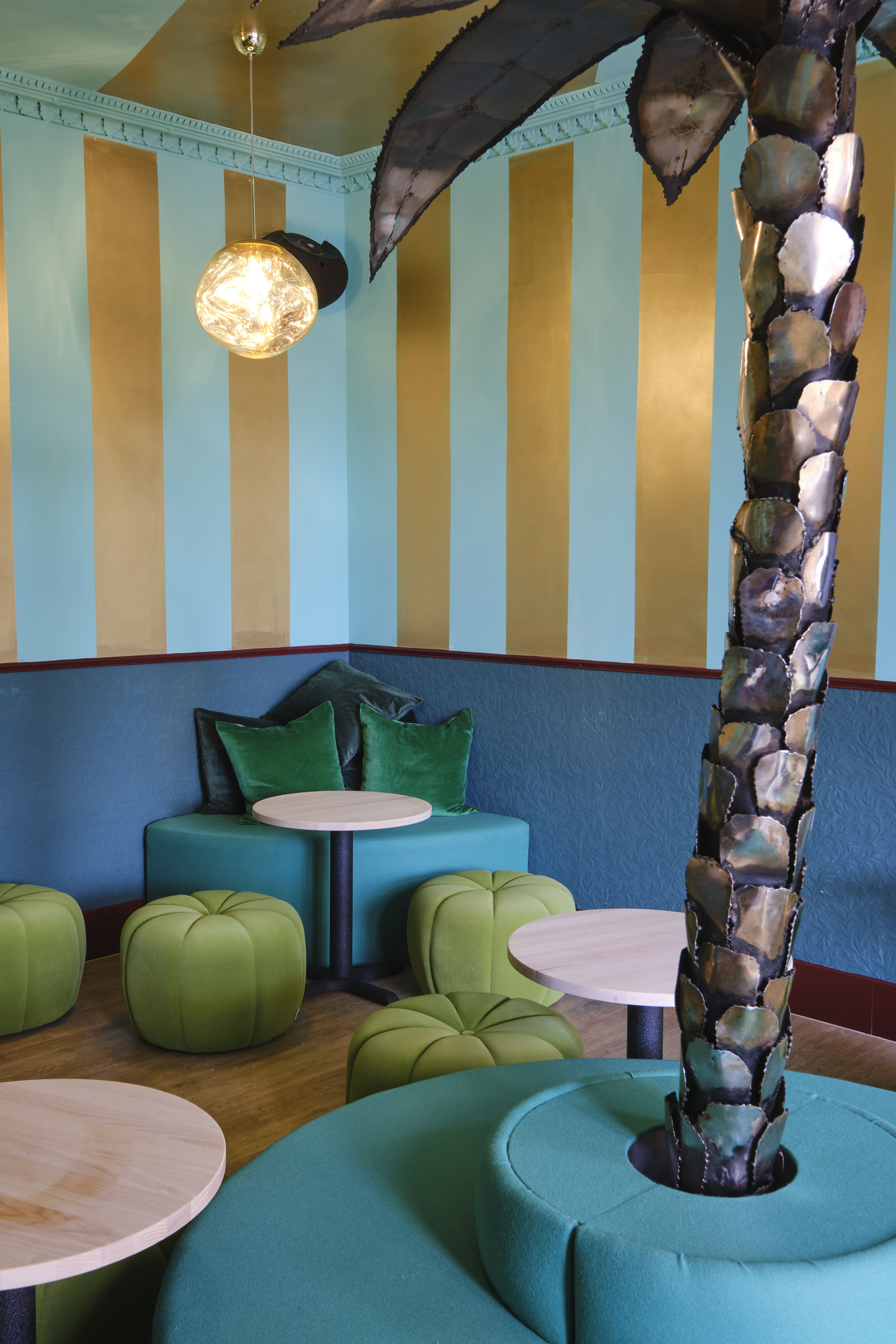 Vibrant Miami Bay meeting space with bold blue and gold stripes, perfect for events.