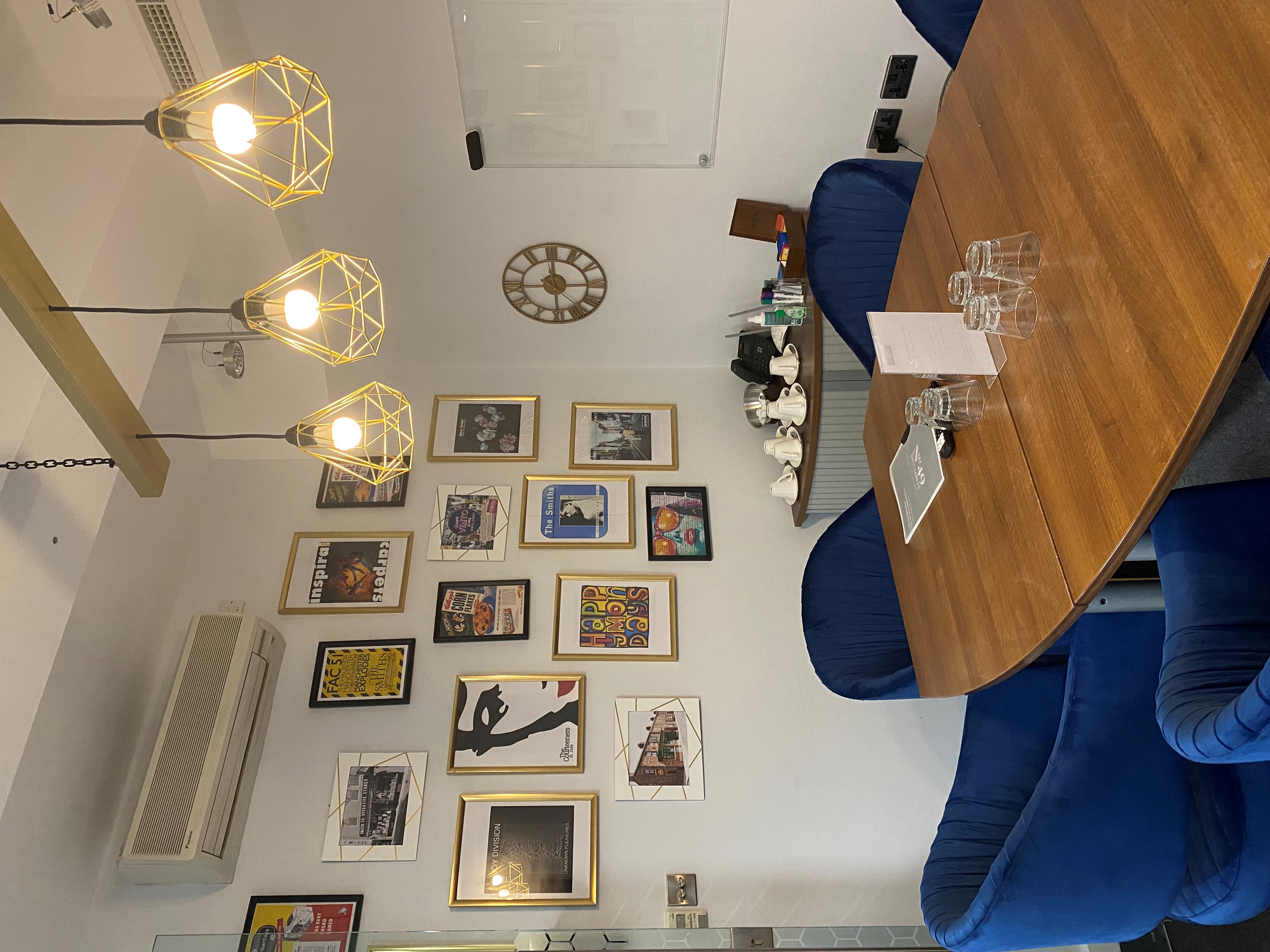 Stylish meeting space at Rylands, featuring a table and seating for brainstorming sessions.