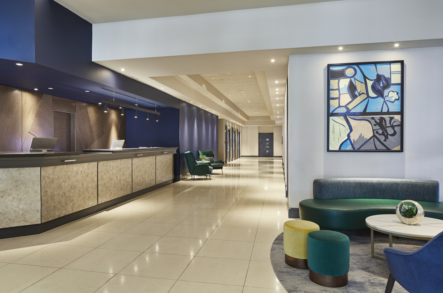 Modern Cardiff Marriott hotel lobby with sleek reception, ideal for meetings and events.