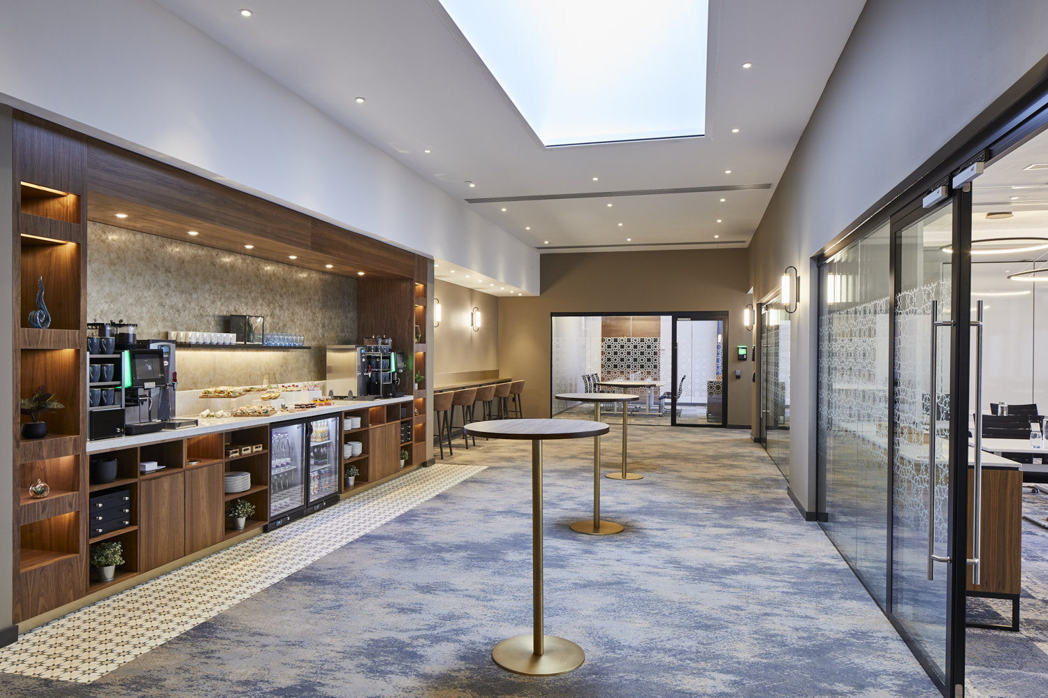 Norman Suite at Cardiff Marriott: modern event space with natural light, ideal for networking.