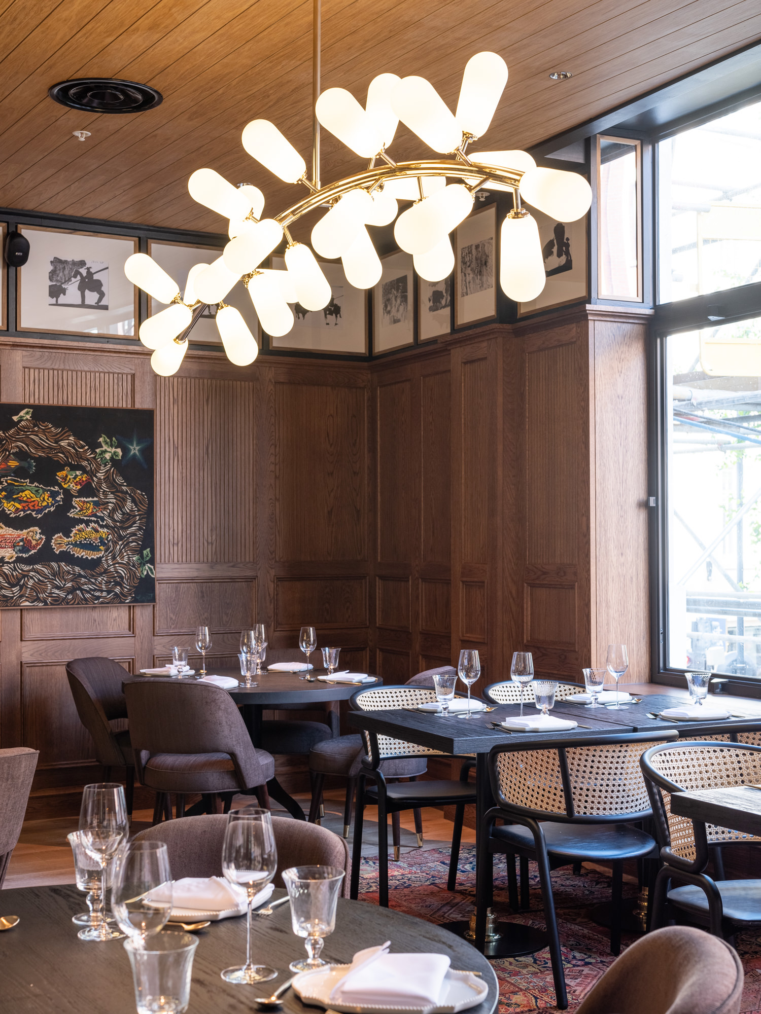 Sophisticated dining space with warm wood paneling for intimate meetings and events.