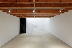 Mimosa House event space with exposed beams, ideal for meetings and workshops.