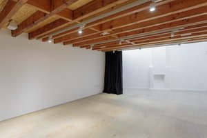 Mimosa House event space with exposed beams, ideal for workshops and gatherings.