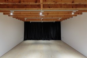 Mimosa House event space with wooden beams, ideal for workshops and gatherings.