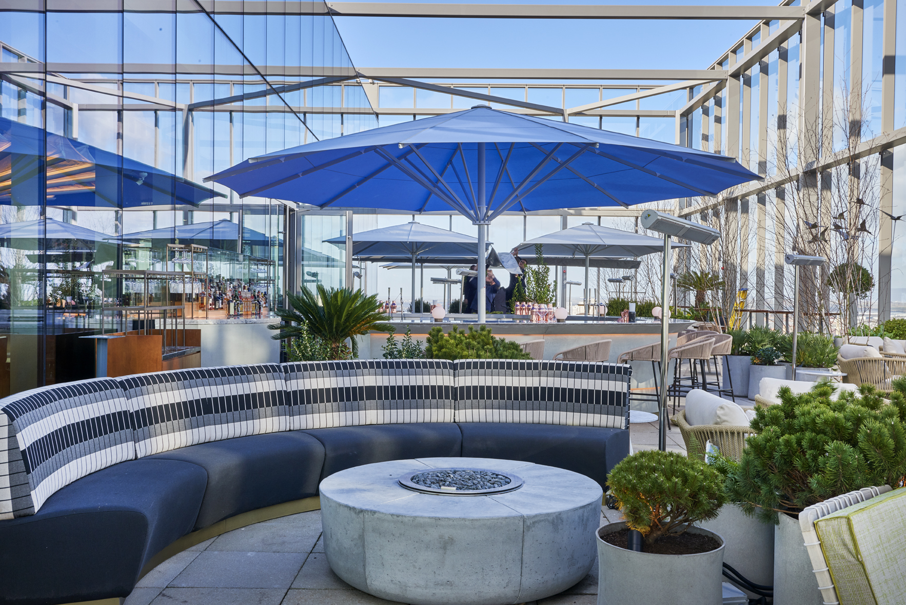 Half Terrace Hire at 20 Stories Restaurant, modern rooftop venue with blue umbrellas for events.