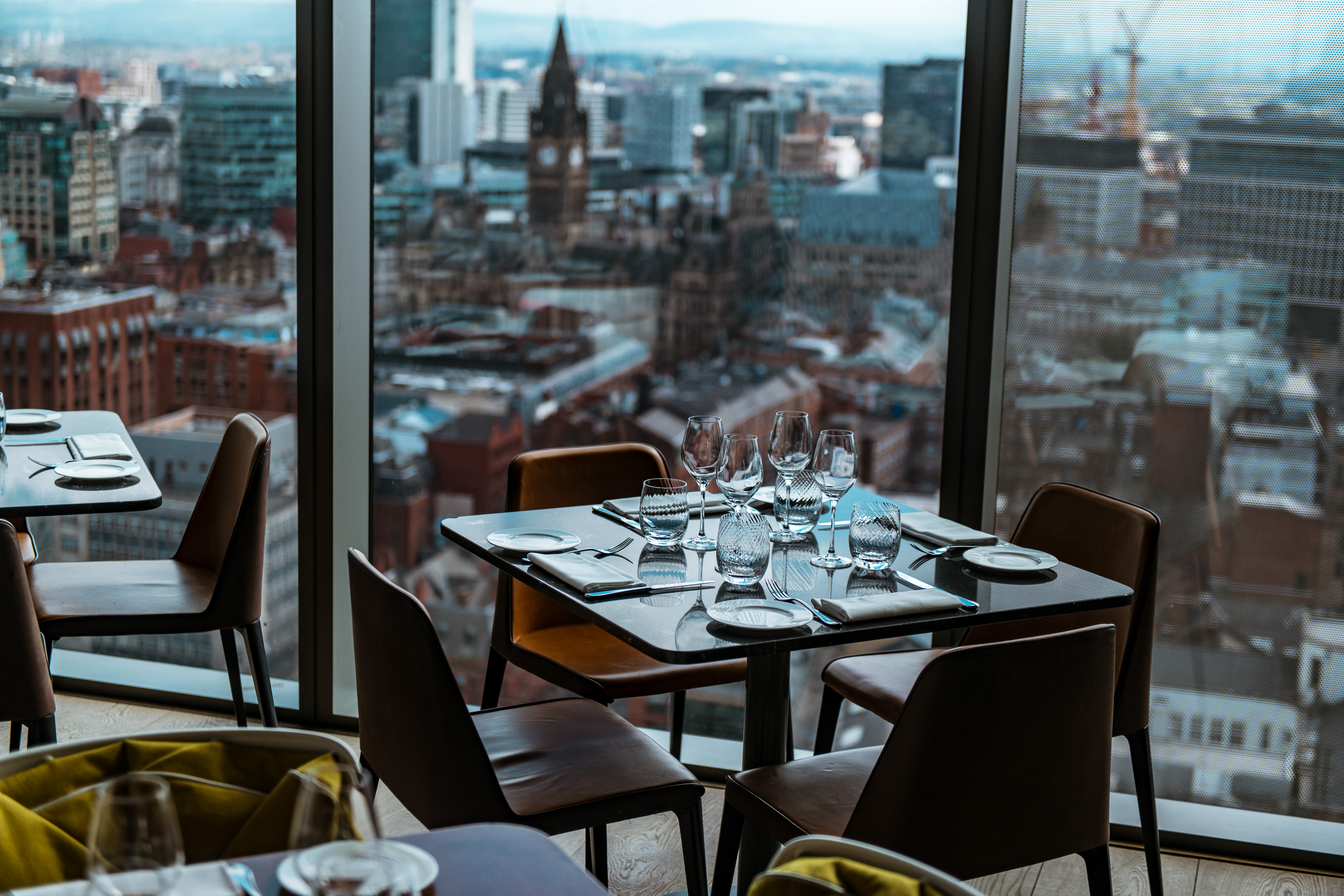 Grill Hire at 20 Stories Restaurant with elegant table settings and city skyline view.