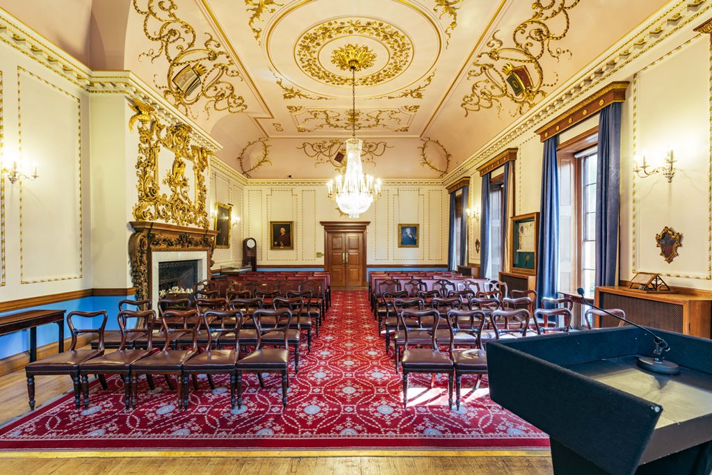 Elegant Court Room with intricate ceiling, perfect for formal meetings and events.