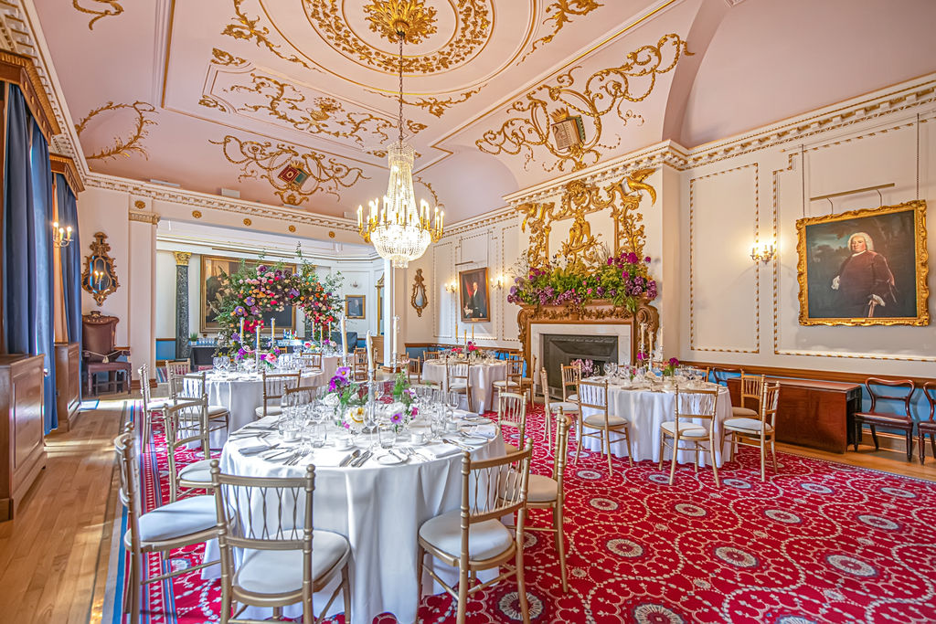 Elegant event space with round tables, ideal for weddings and corporate functions.