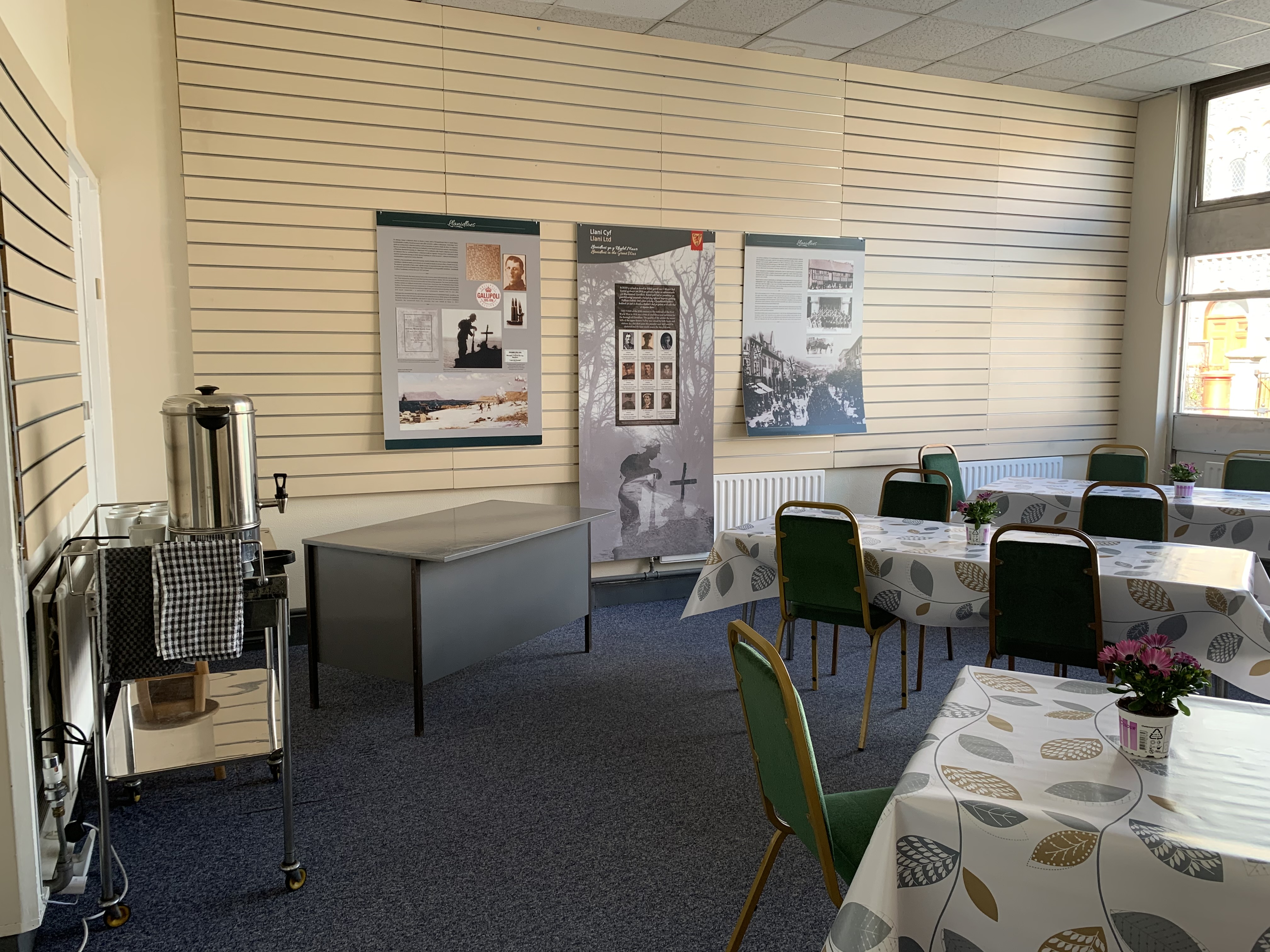 Llani Pop Up meeting space with floral tablecloths, perfect for workshops and conferences.