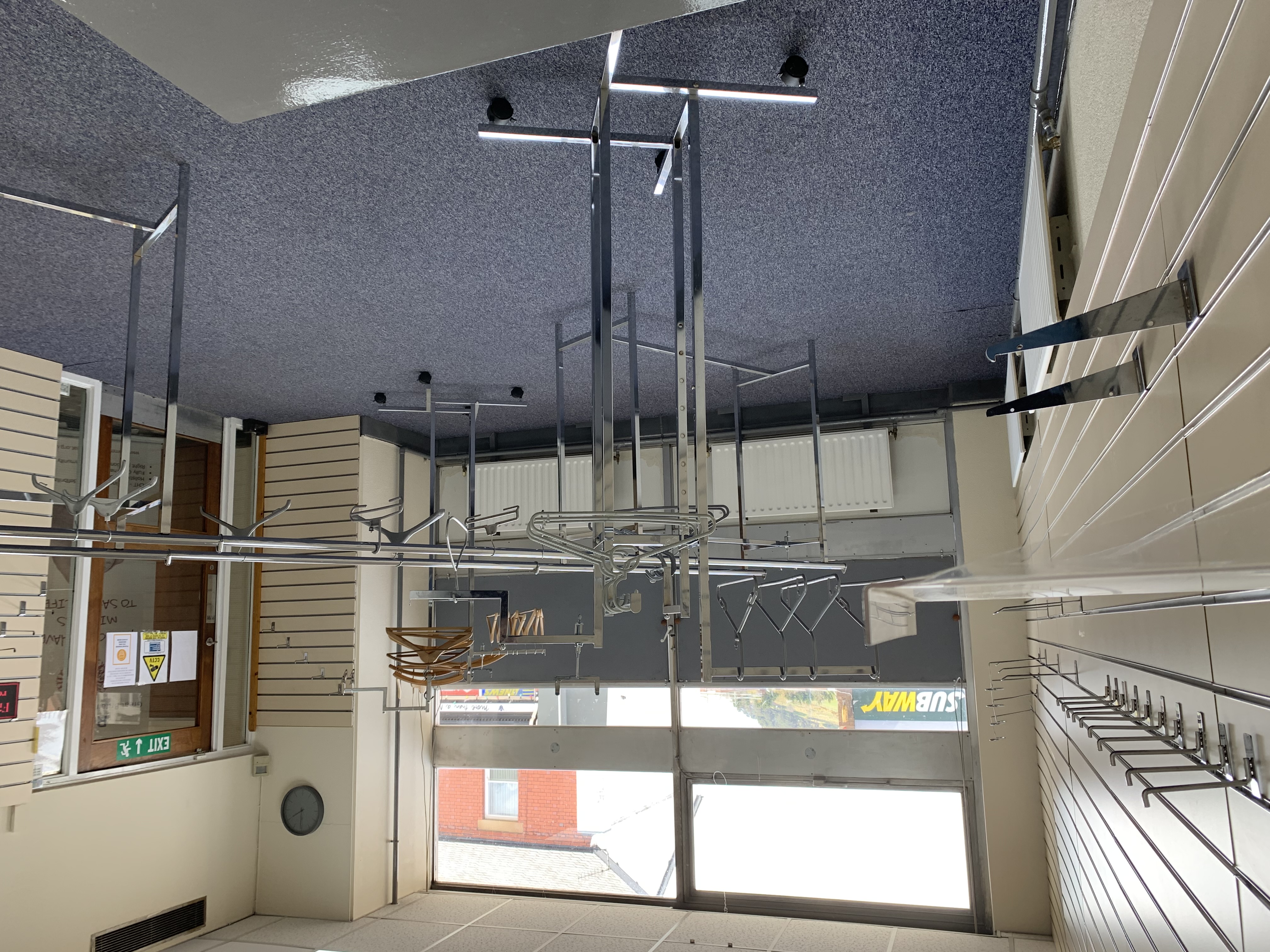 Spacious Llani Pop Up area with clothing racks for event check-in and wardrobe management.