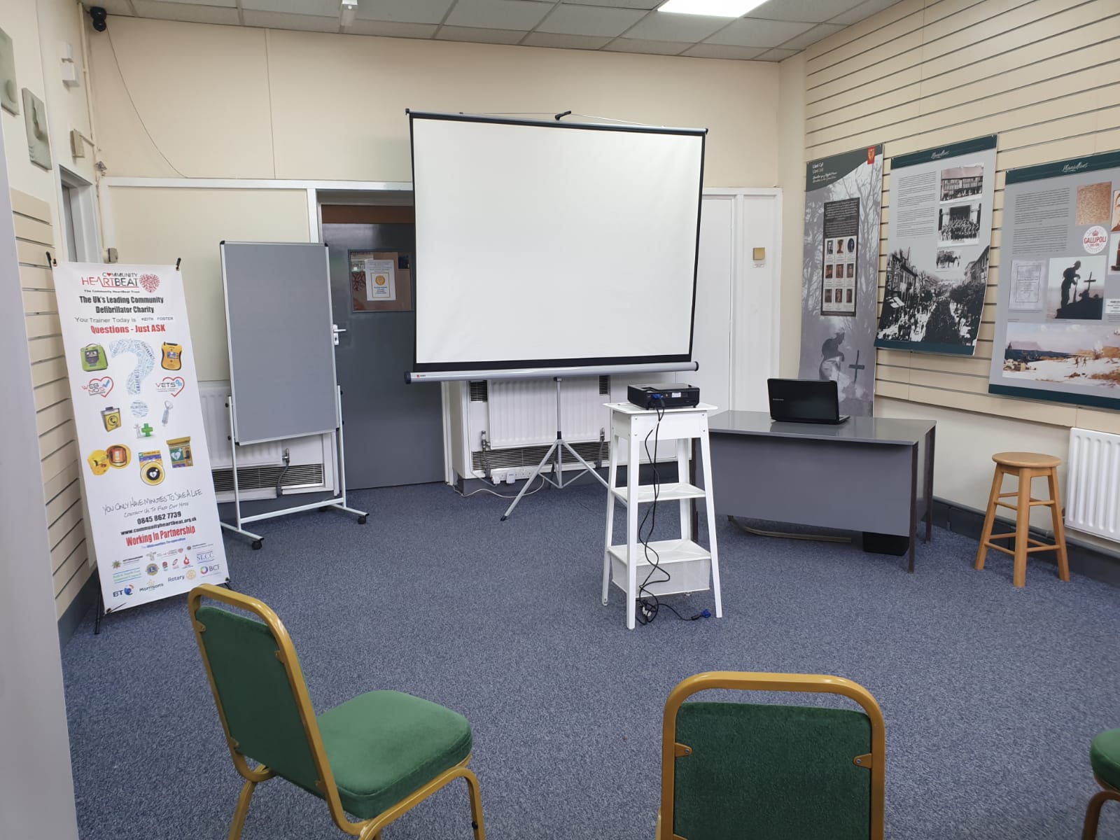 Small meeting room with projector for intimate workshops and presentations.