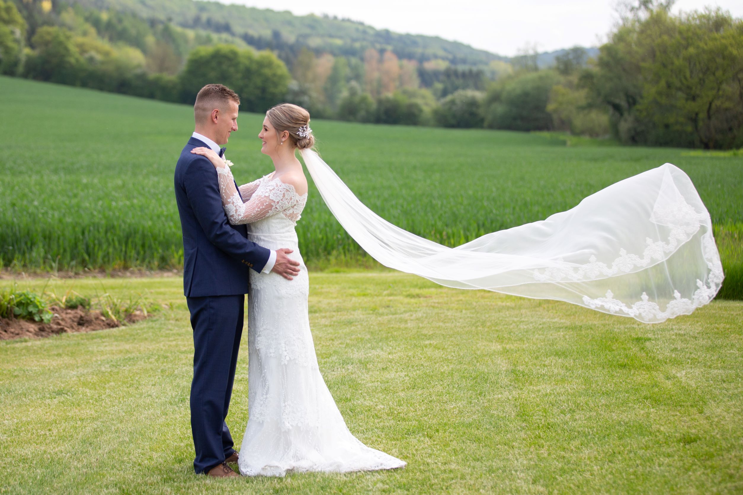 Couple with flowing veil at Eaton Manor Events Centre, perfect for weddings and outdoor events.