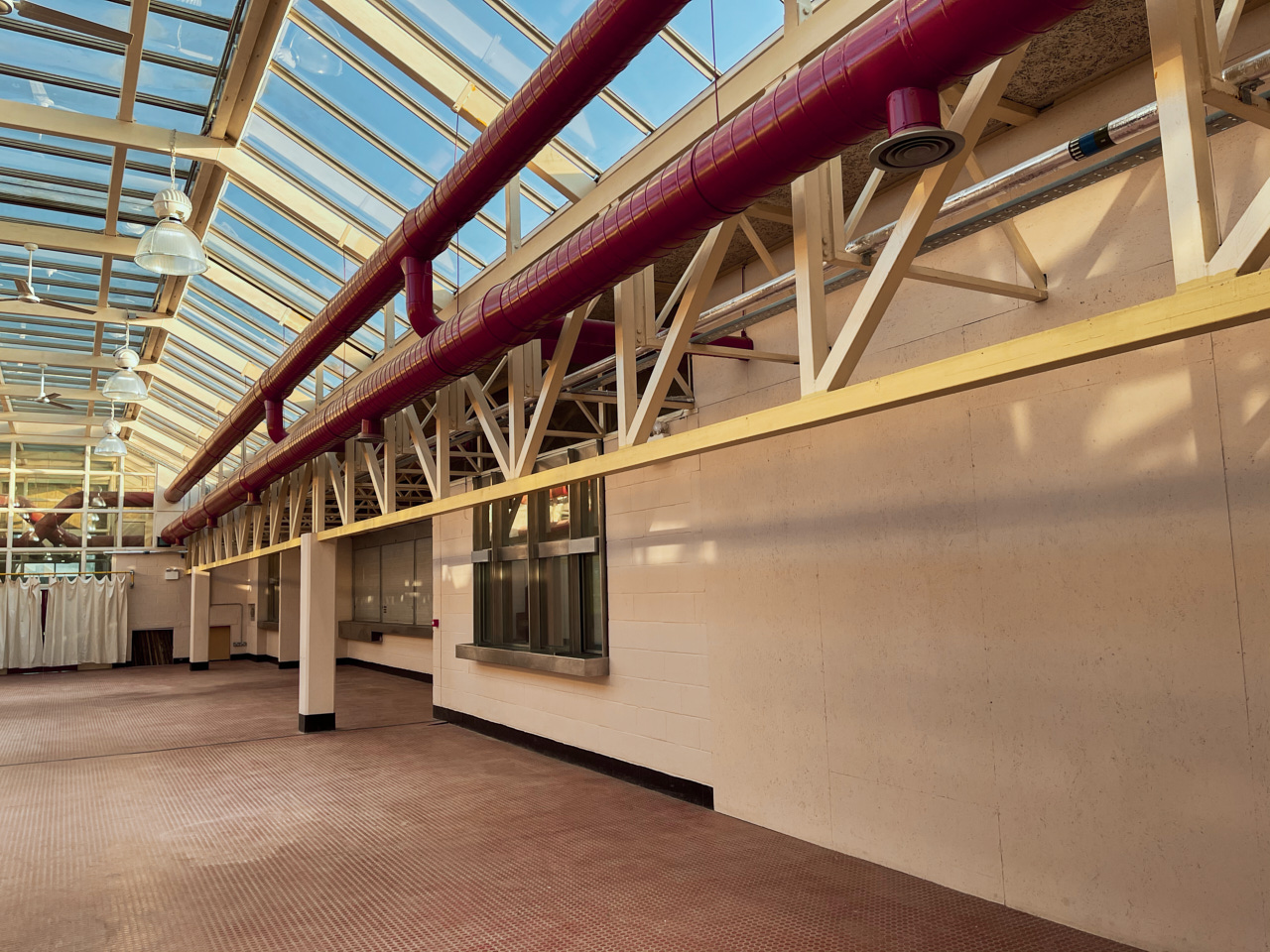 Hackney Depot Main Hall: spacious venue with glass ceiling for networking events and exhibitions.