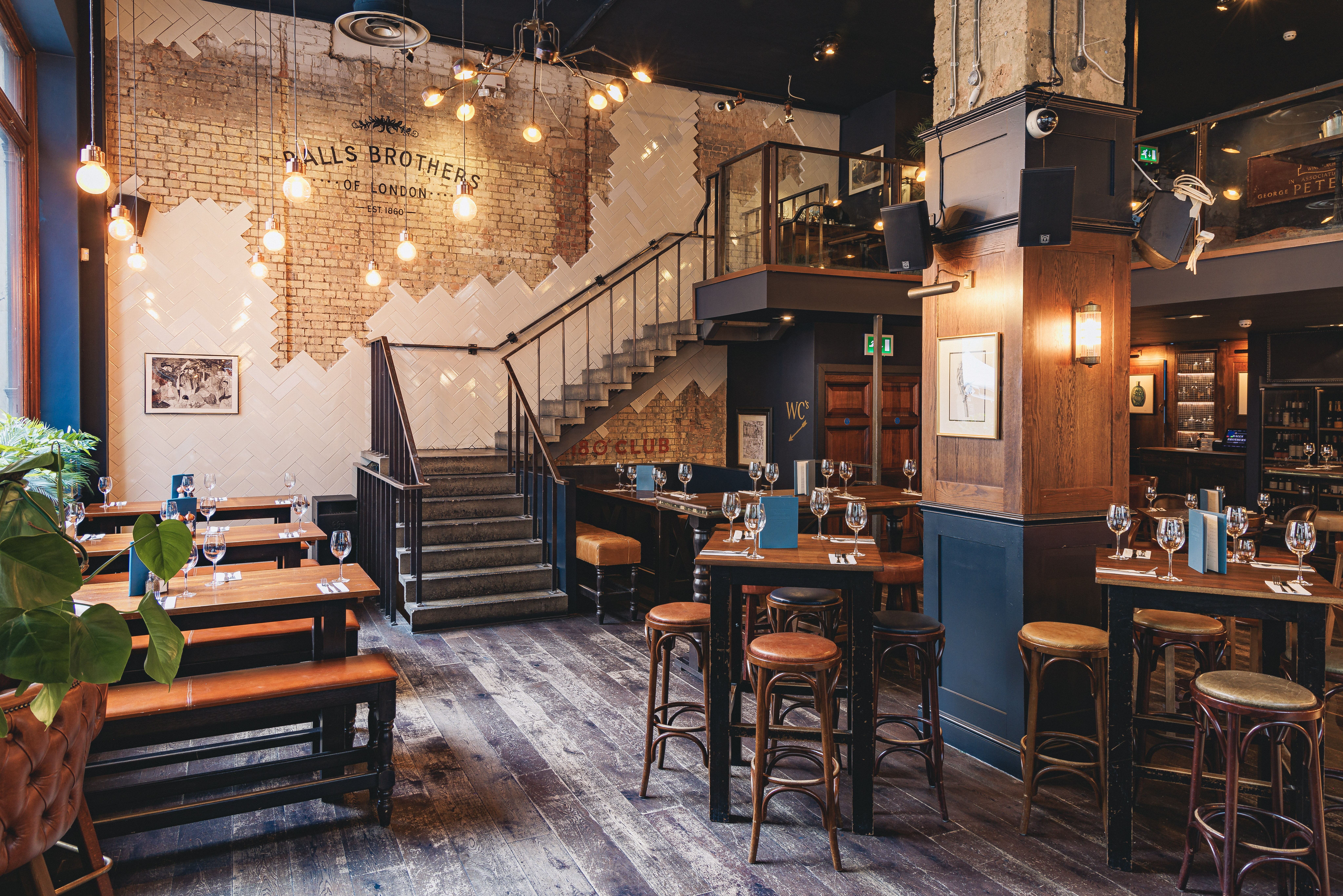 Stylish venue with wooden tables and warm ambiance for networking events or intimate dinners.