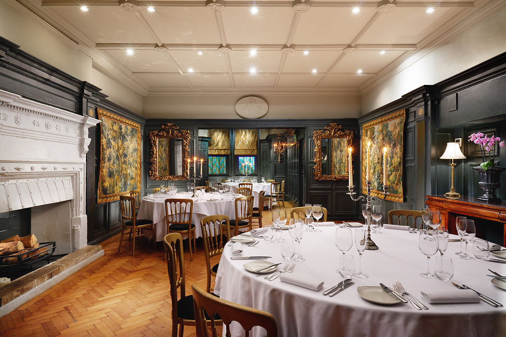 Elegant dining room with round tables for formal events at The Tapestry & Mulberry.