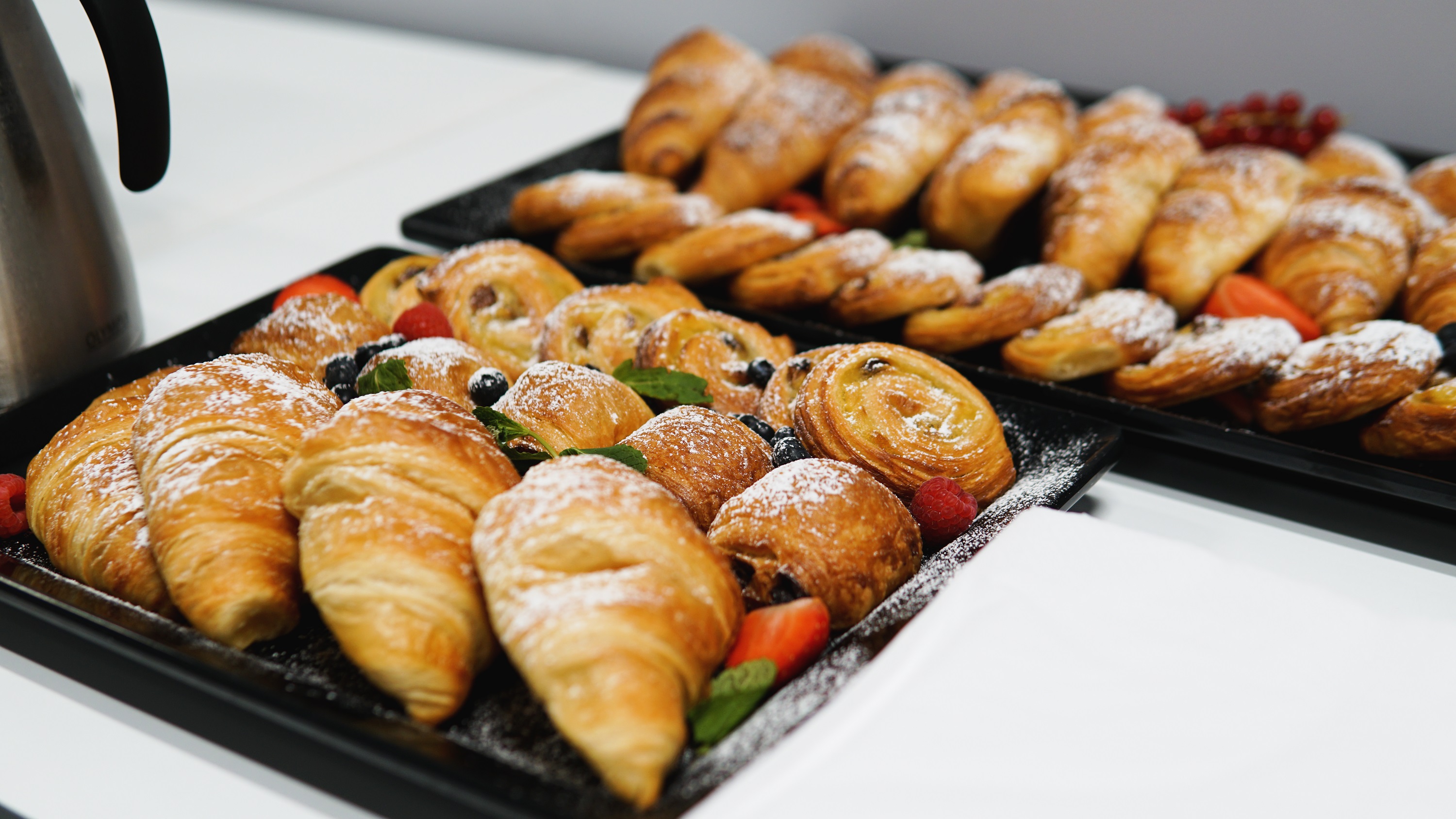Freshly baked pastries display at Gravity MAX Wandsworth for events and networking.
