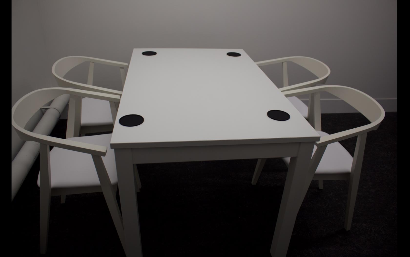 Creative studio space with minimalist meeting setup for podcasts and brainstorming sessions.