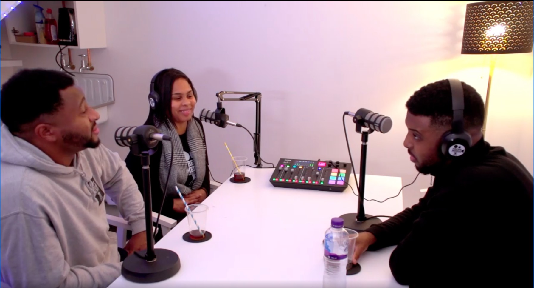 Creative studio podcast room with participants, ideal for engaging discussions and sound quality.