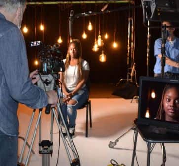 Professional video shoot at Broadley Studio with soft lighting and crew for interviews.