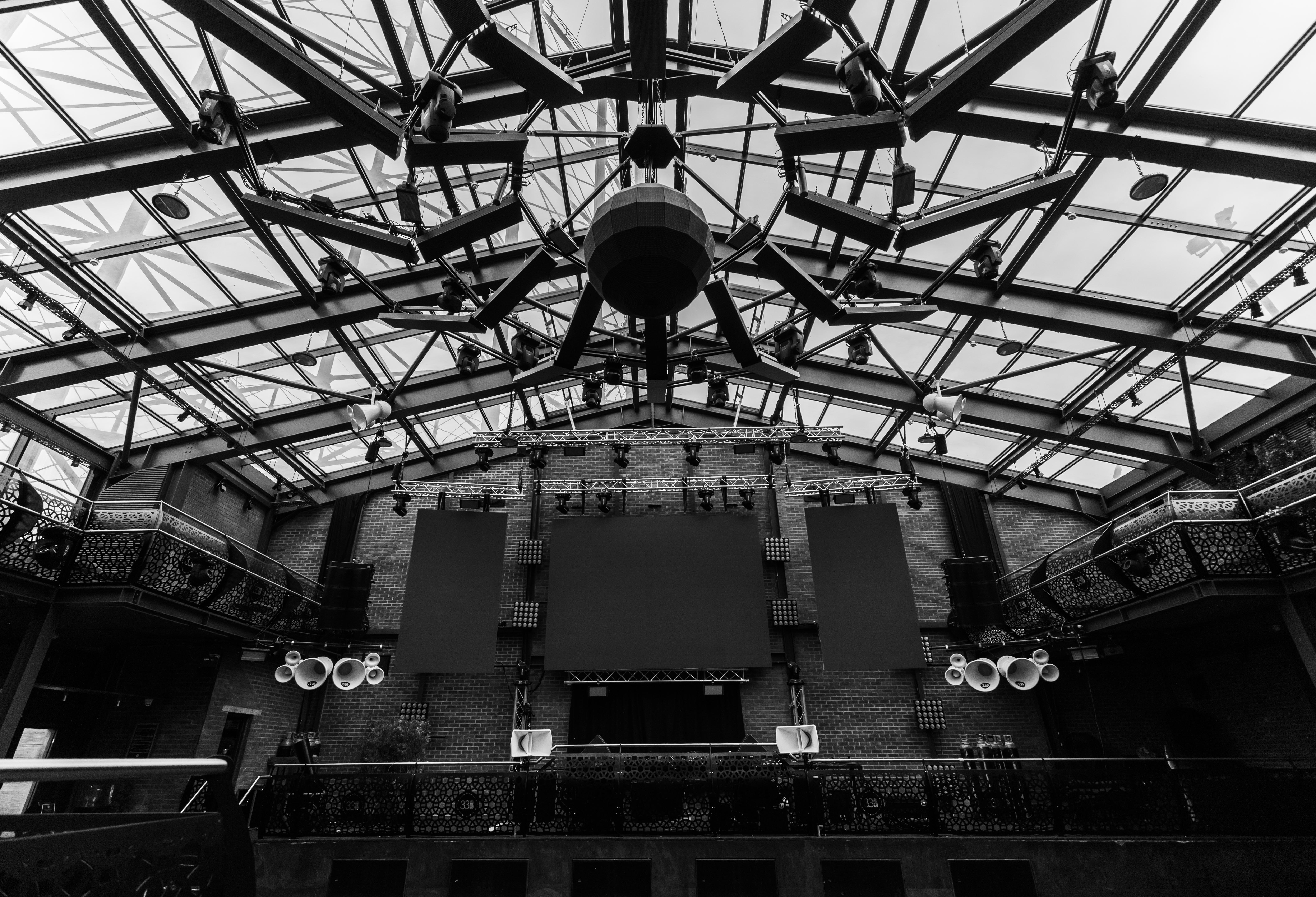 Spacious Terrace venue with glass ceiling, ideal for conferences and performances.