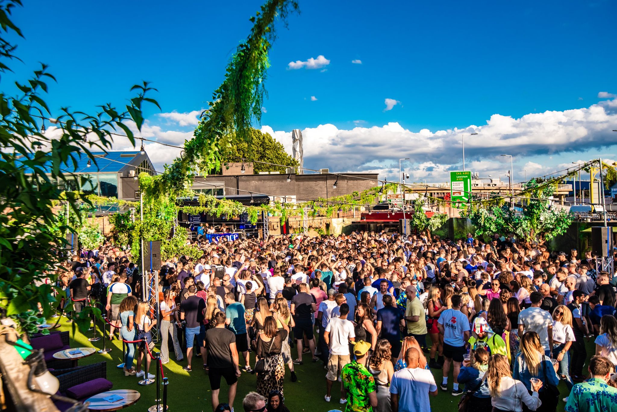 Vibrant outdoor event at Studio 338 with lush greenery, ideal for festivals and networking.